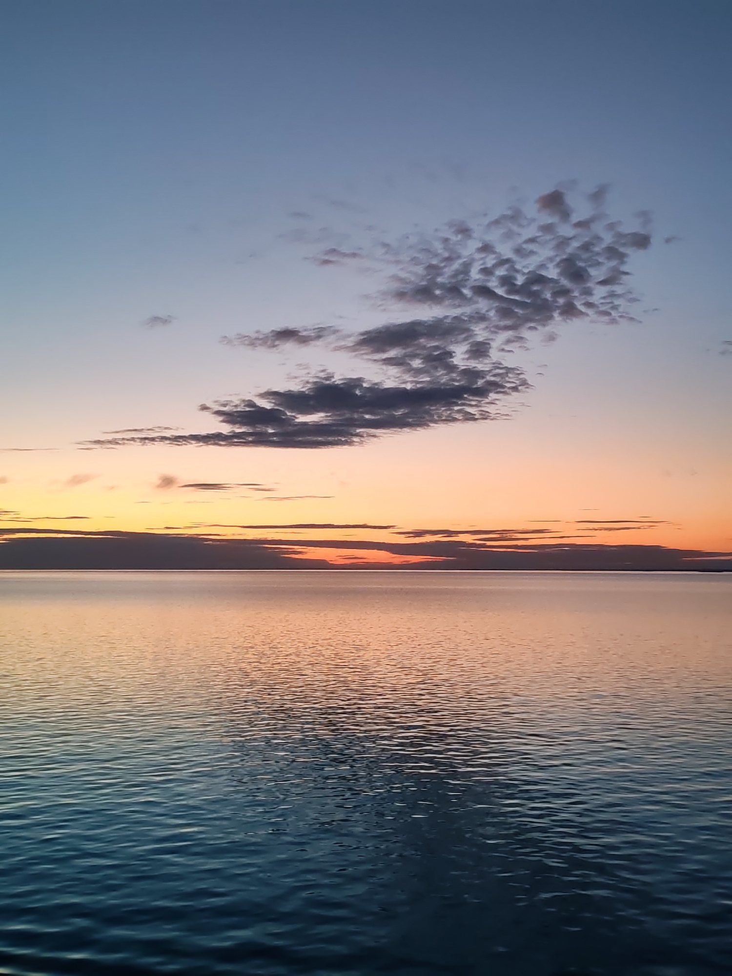 Twilight waterscape captured in sequential images across Russian lake