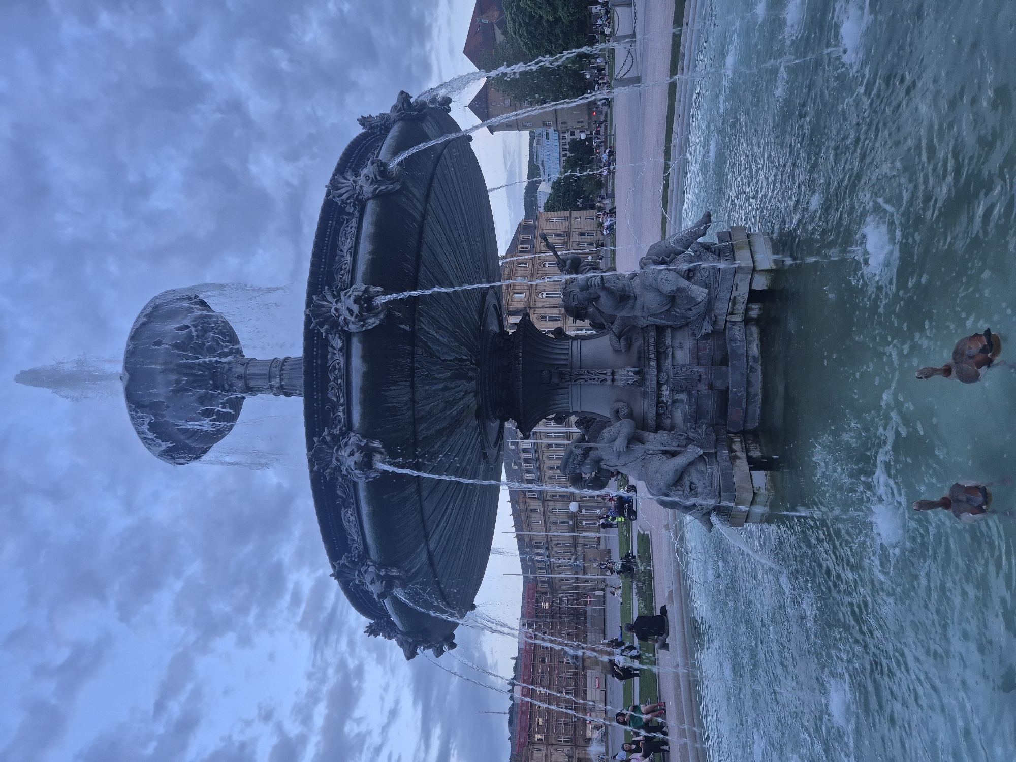 Evening fountain scenes documented across Stuttgart city squares