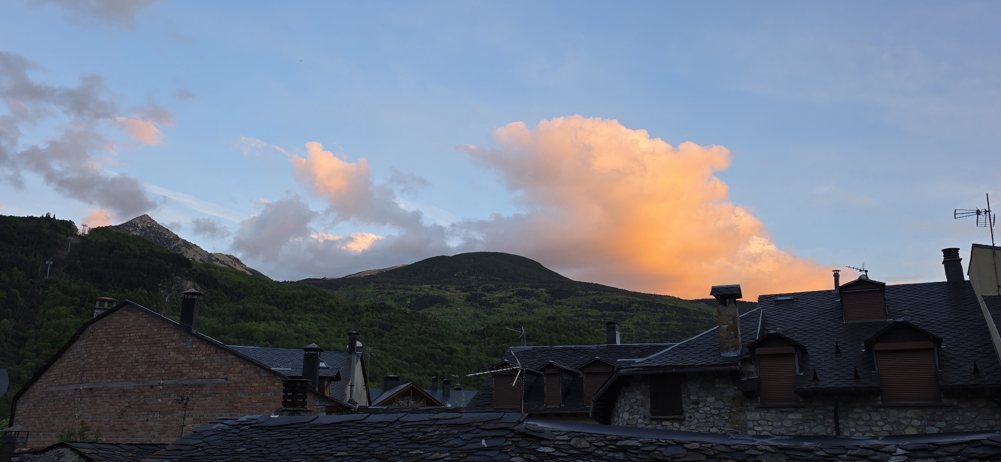 Evening sunset views captured over Benasque rooftops and Pyrenees