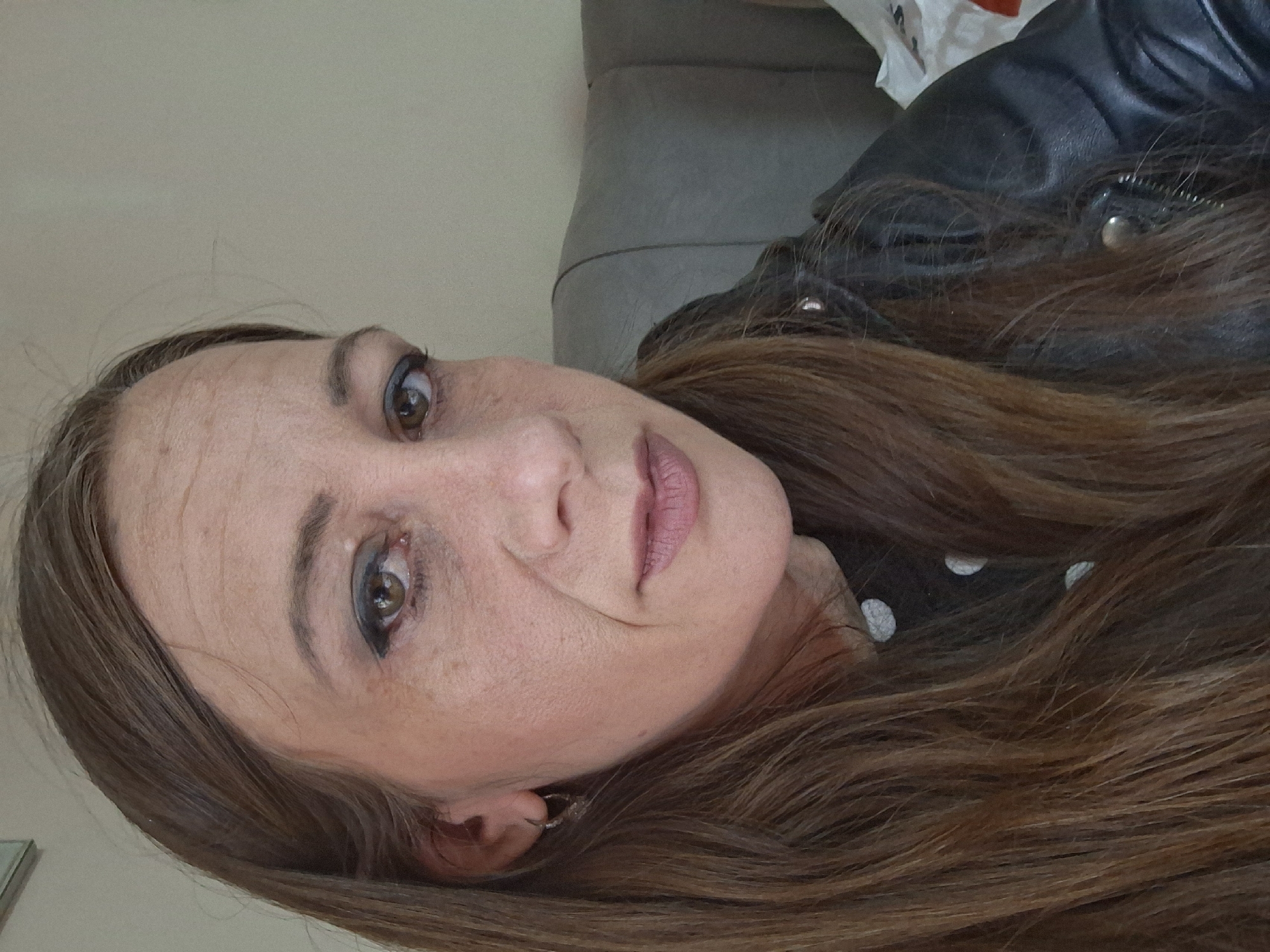 Woman with brown hair observed in Bulgarian village