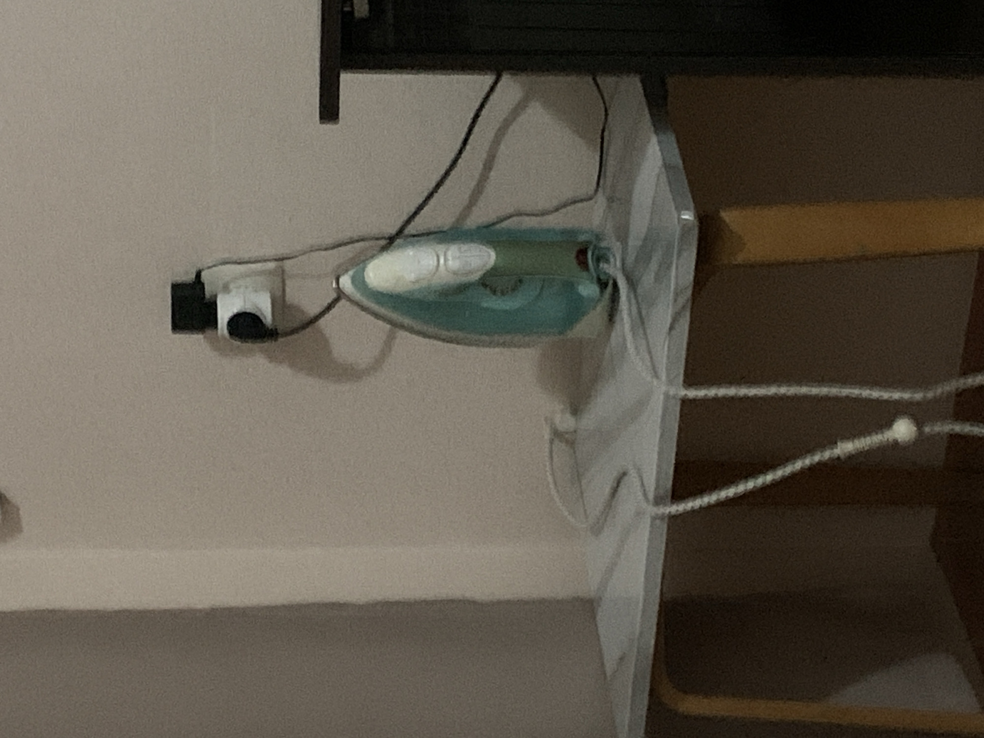 Electric iron documented in Stavropol indoor setting