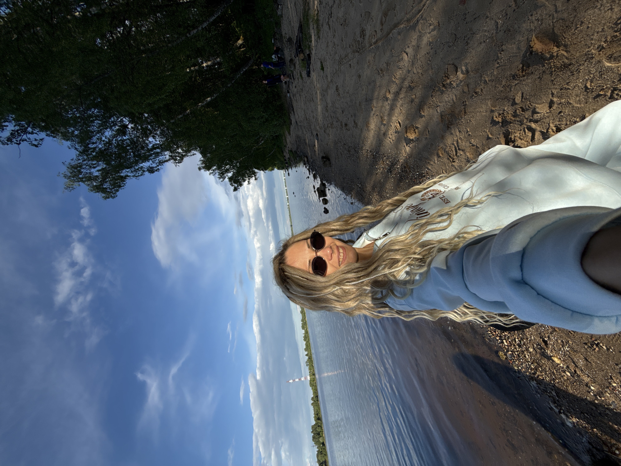 Woman takes selfie by water in Шебунино, Russia