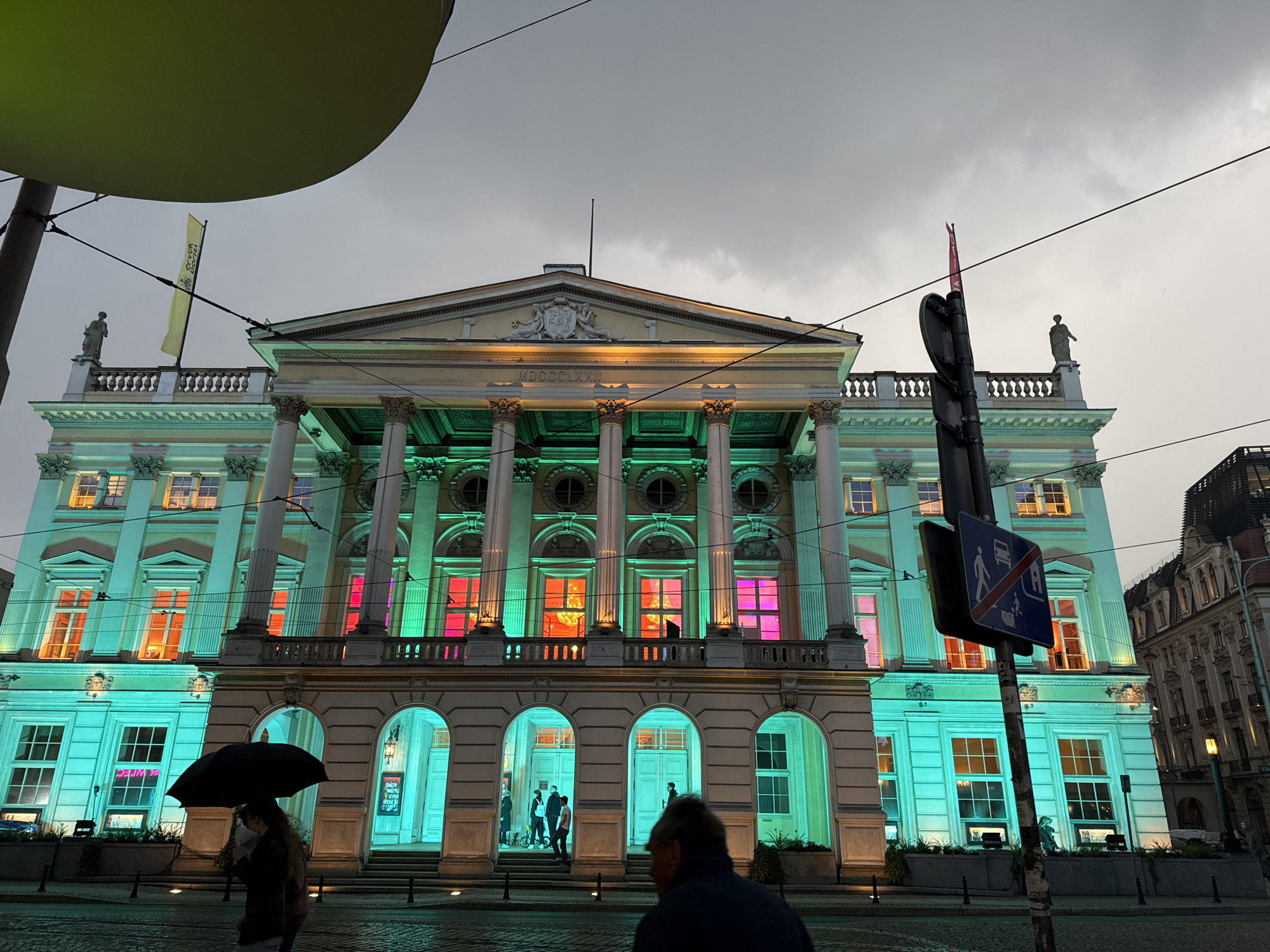 Rainy evening stroll through illuminated Wrocław landmarks and gardens