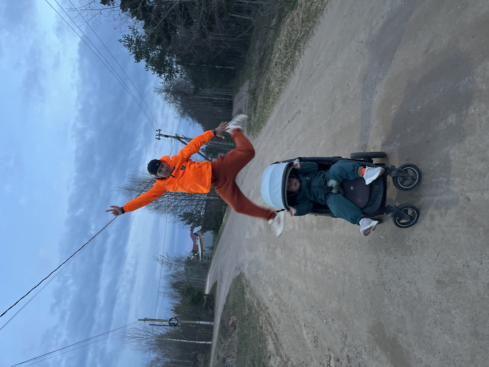Family enjoys evening playtime on rural road in Chaikovsky