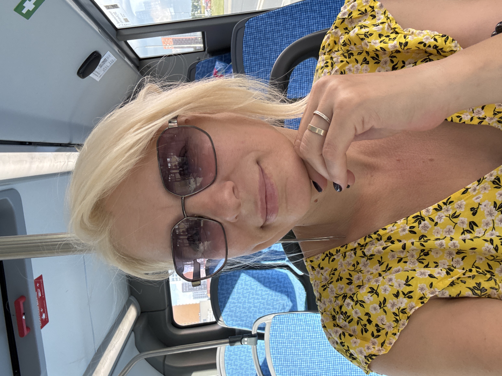 Selfie on a Moscow bus, yellow dress and sunglasses