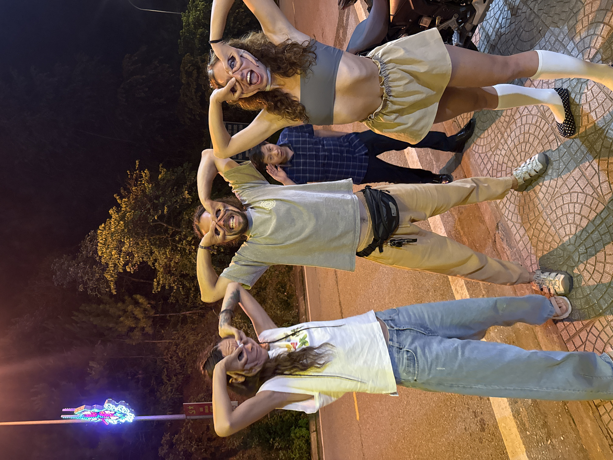 Friends socialize playfully during nighttime outing in Mù Cang Chải