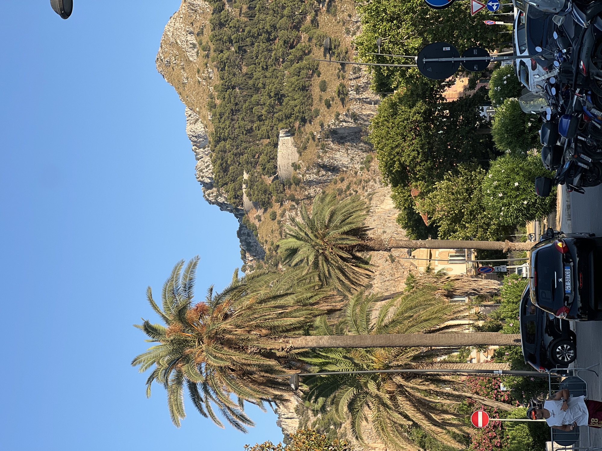 Quiet afternoon at Mondello Beach with a superyacht anchored offshore