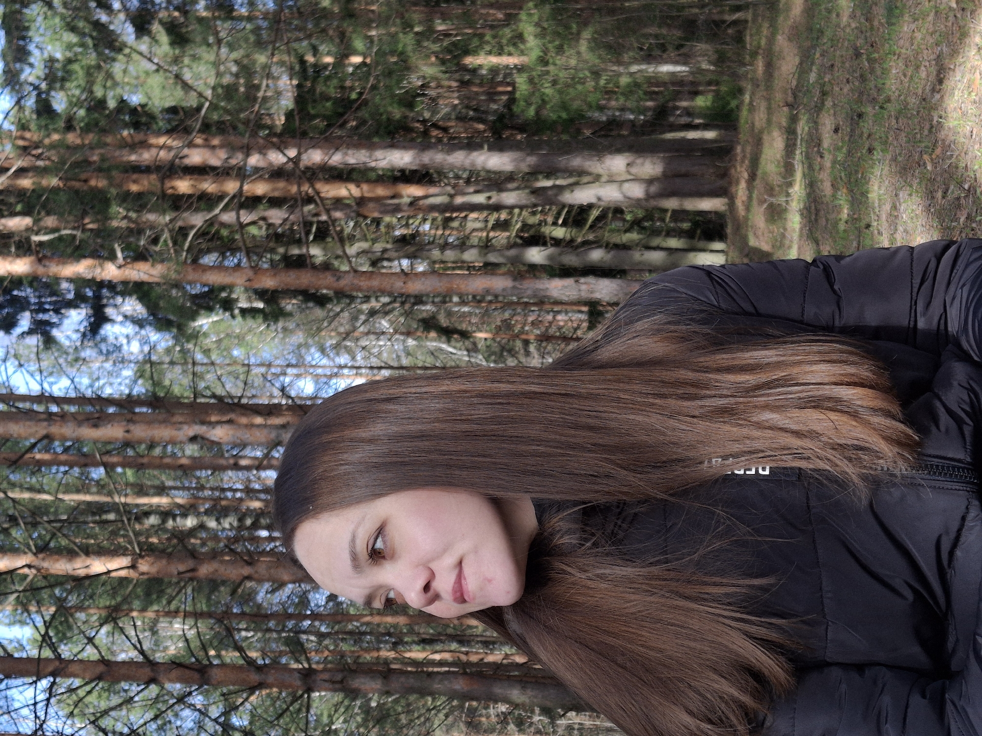 Woman photographed in pine forest near Chaikovsky, Russia