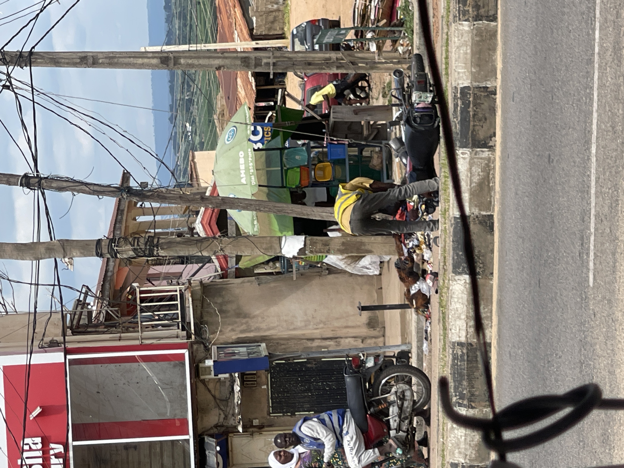 Street life and vehicle activity in a busy West African urban area