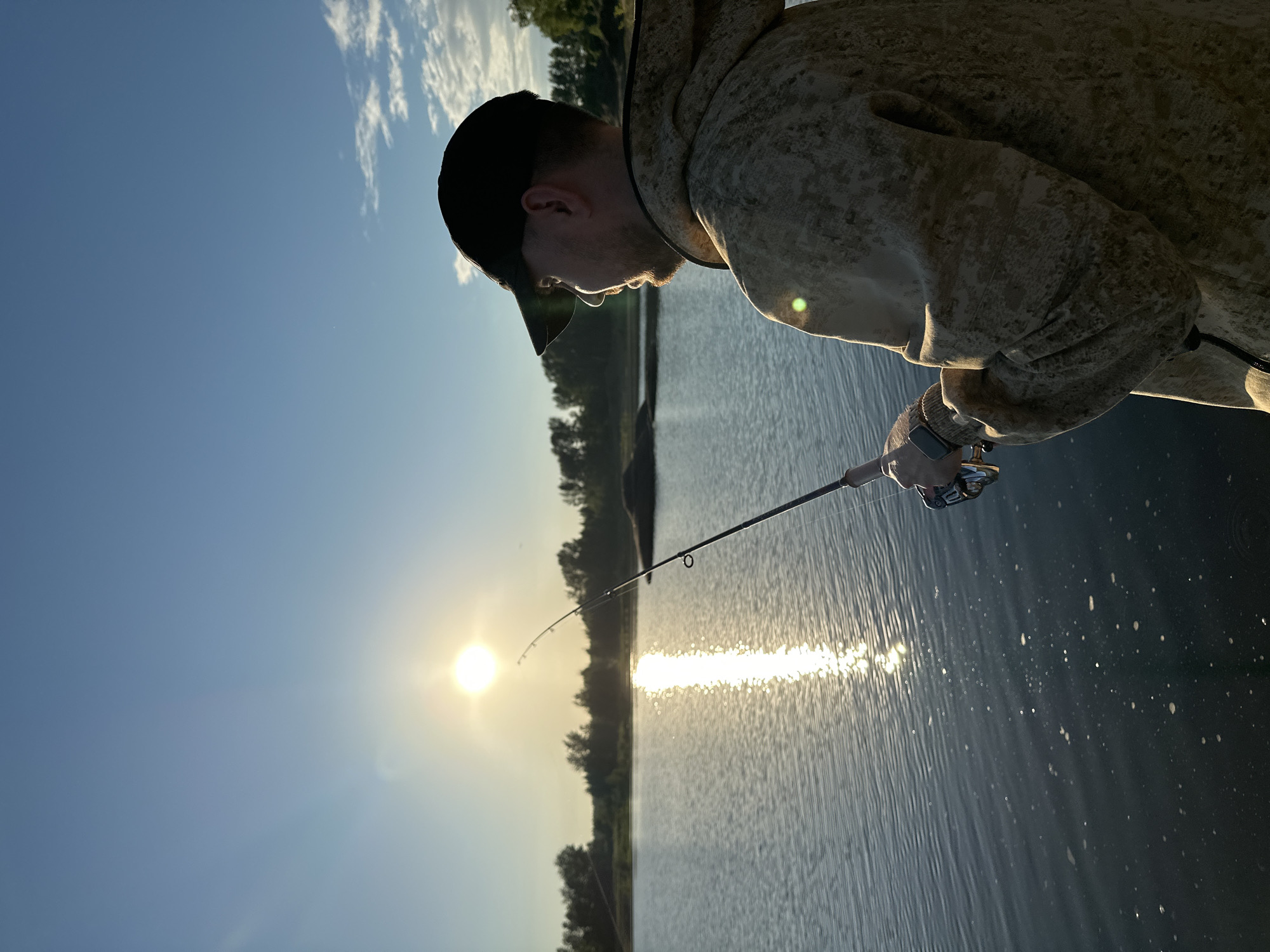Evening fishing session on calm waters in Chaikovsky, Russia