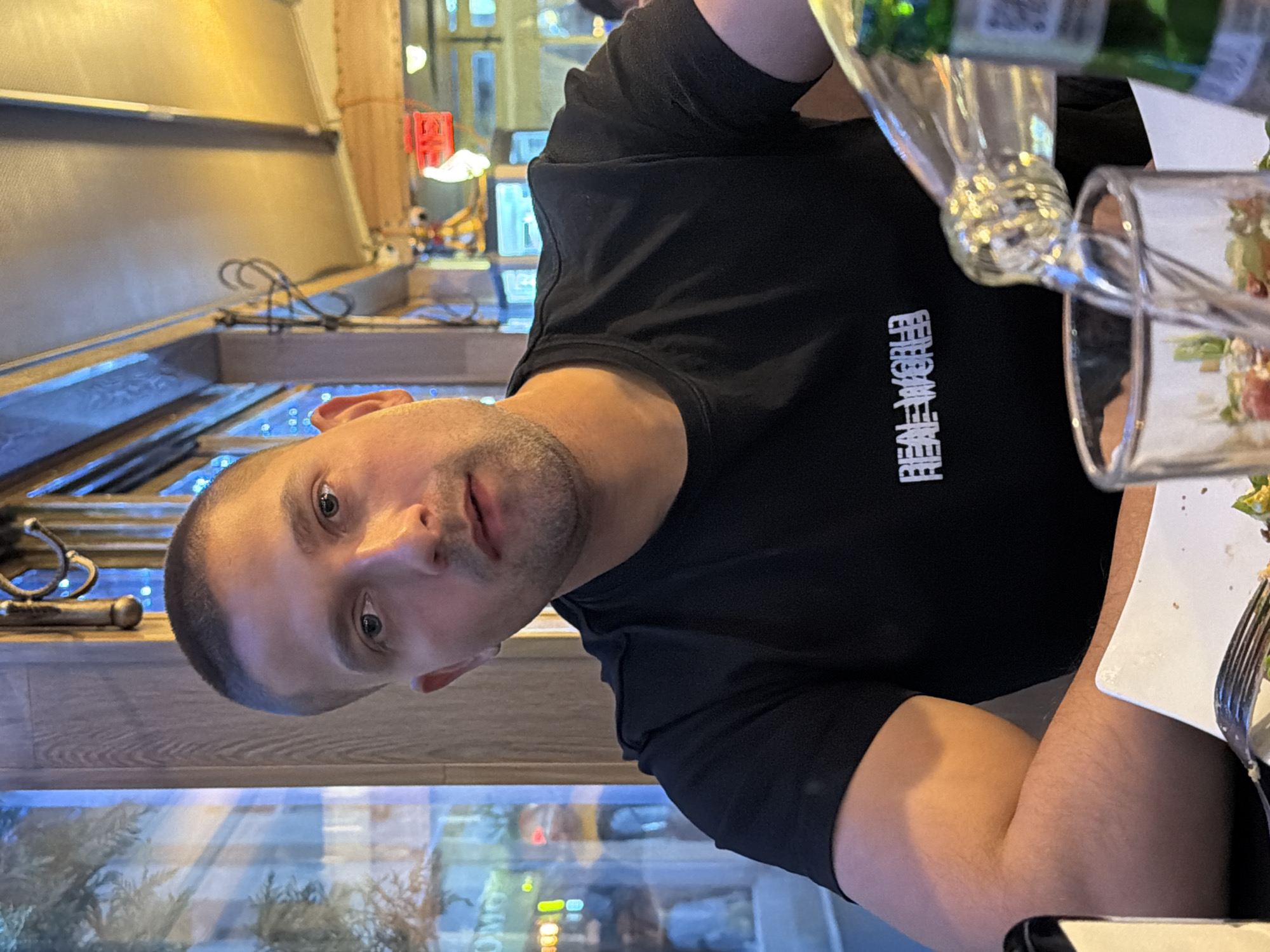 Man dines on sushi and salad at restaurant