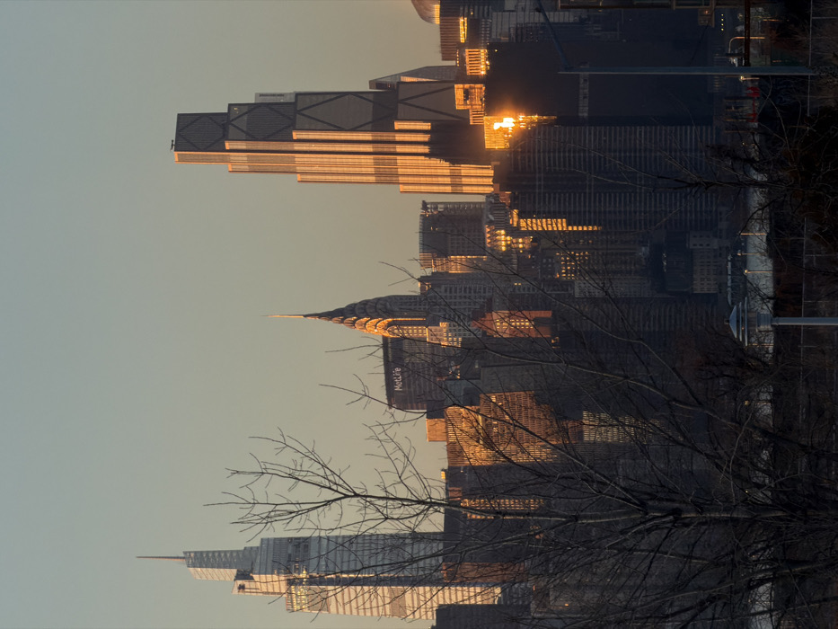 Manhattan skyline draws viewers during golden hour sunset February 28