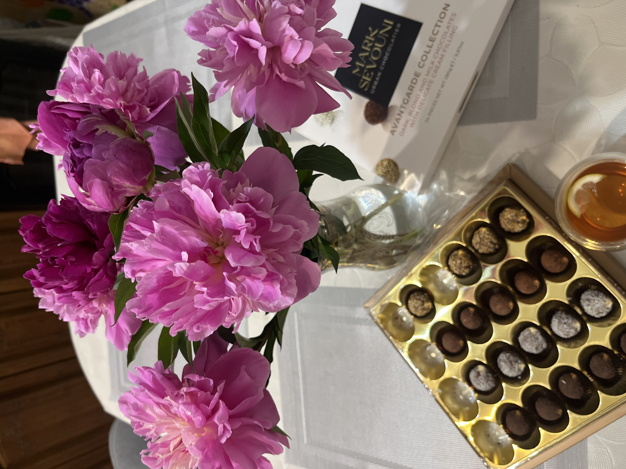 Afternoon chocolate tasting with peonies documented in Kaspiysk, Russia