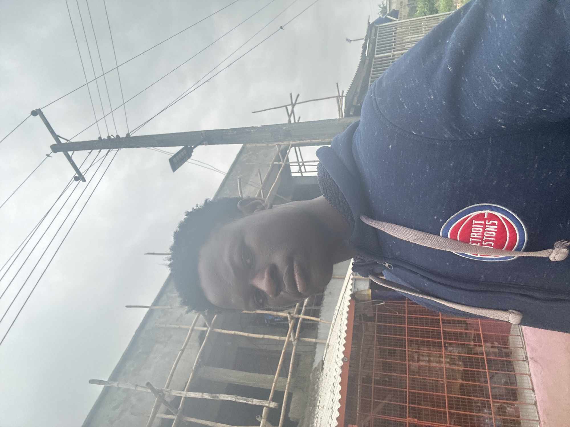 Cattle and pedestrians share a Badagry street on a quiet morning