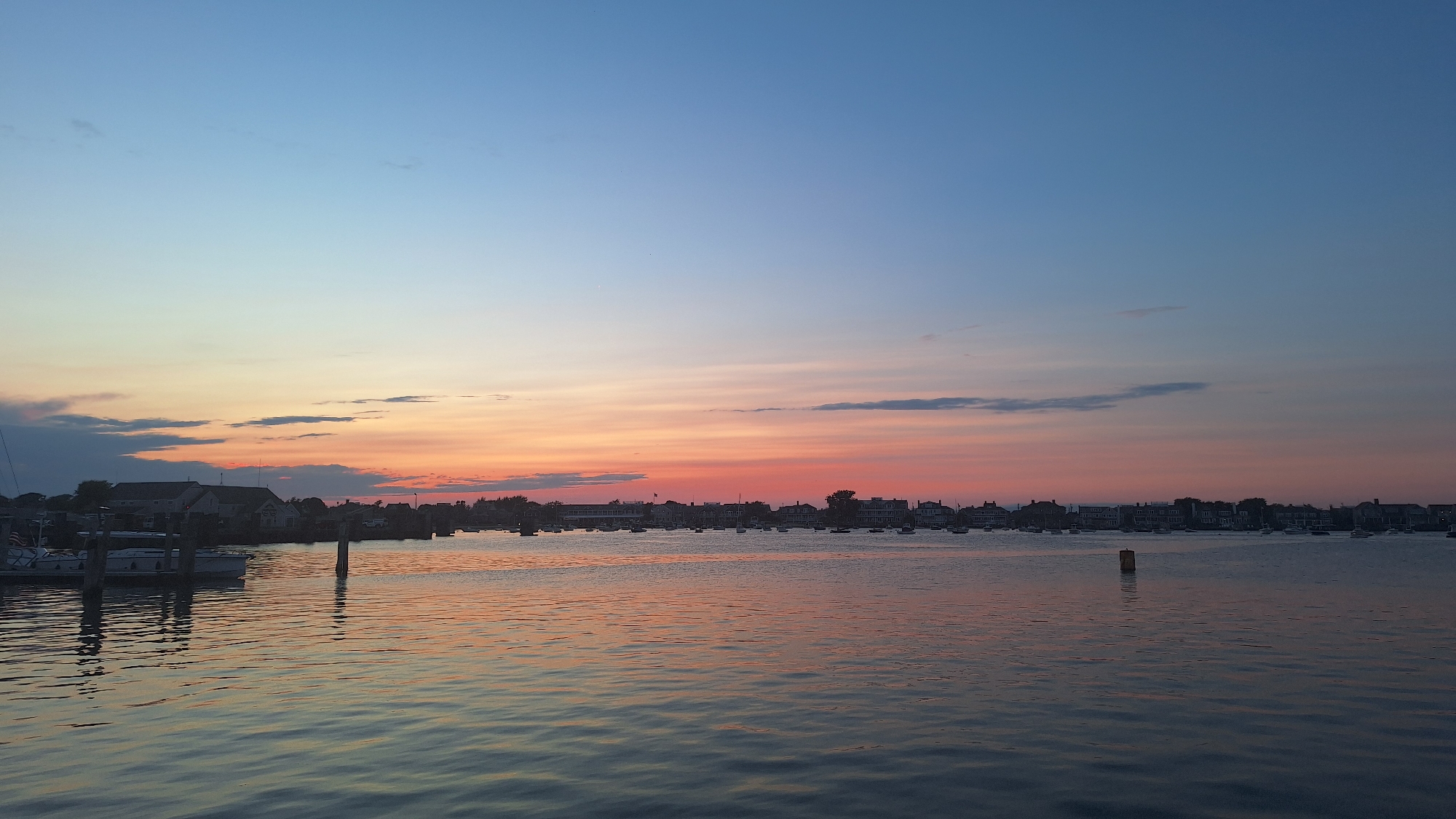 Nantucket Harbor glows at dusk across multiple angles