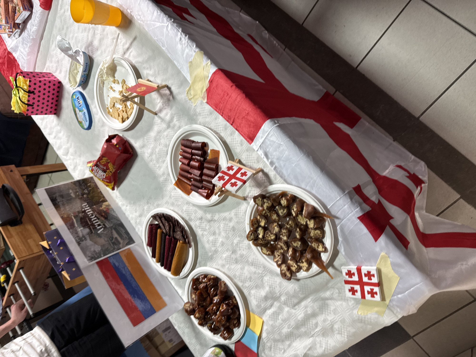 Multicultural food gathering features international flags in Opole, Poland