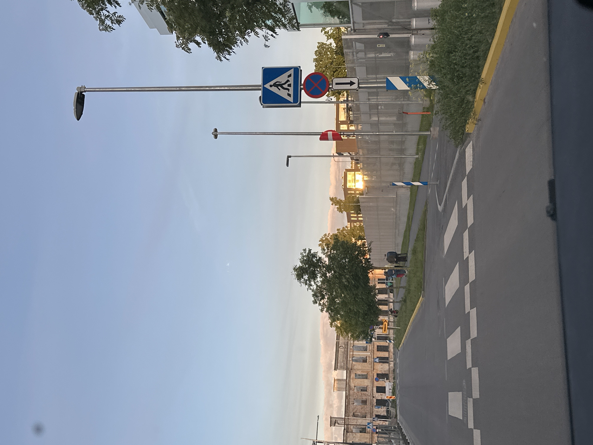 Evening stroll documented through Tallinn's harbor district at sunset