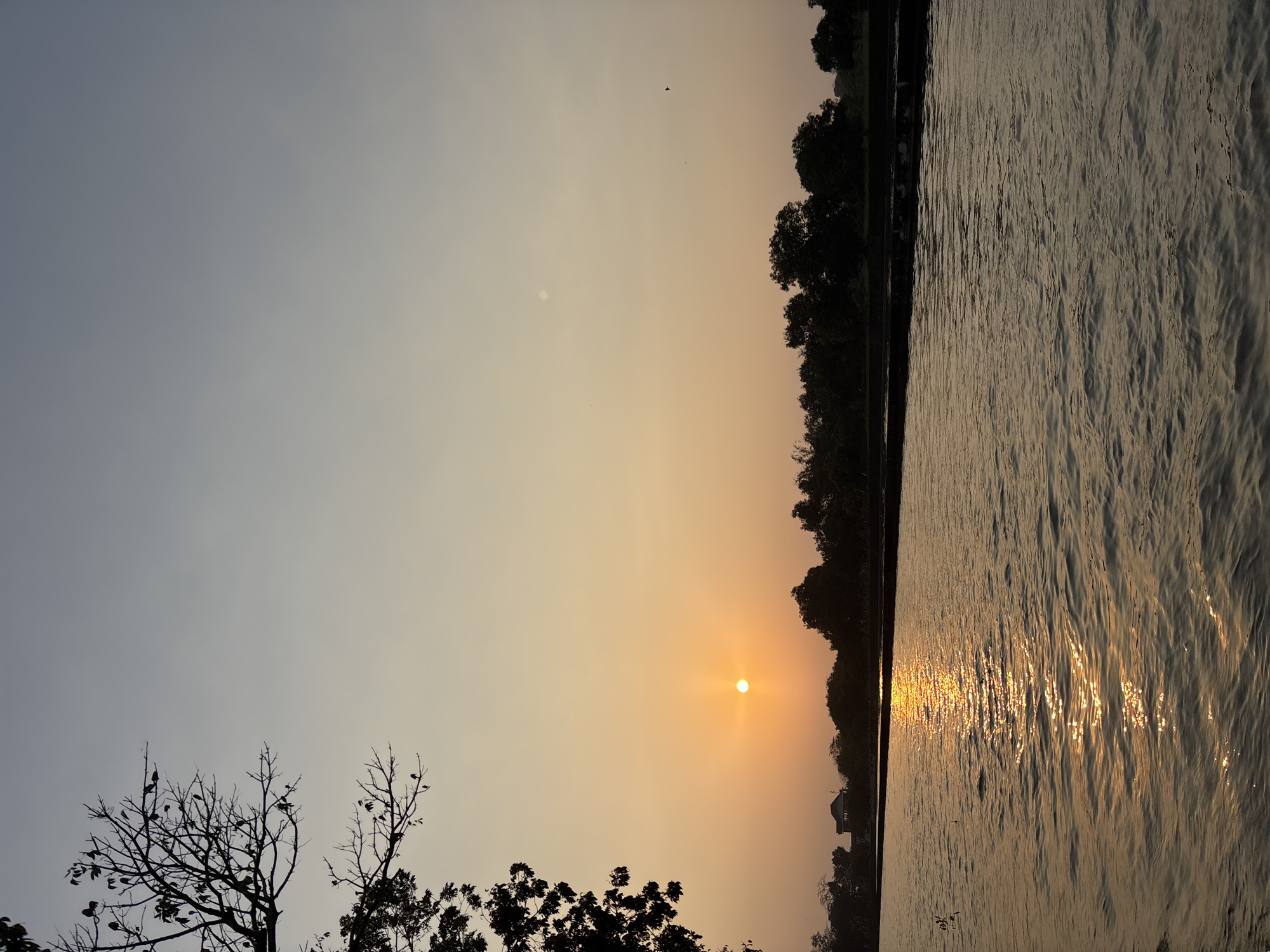 Sunset over West Java canals and the Pintu Air 10 irrigation gate
