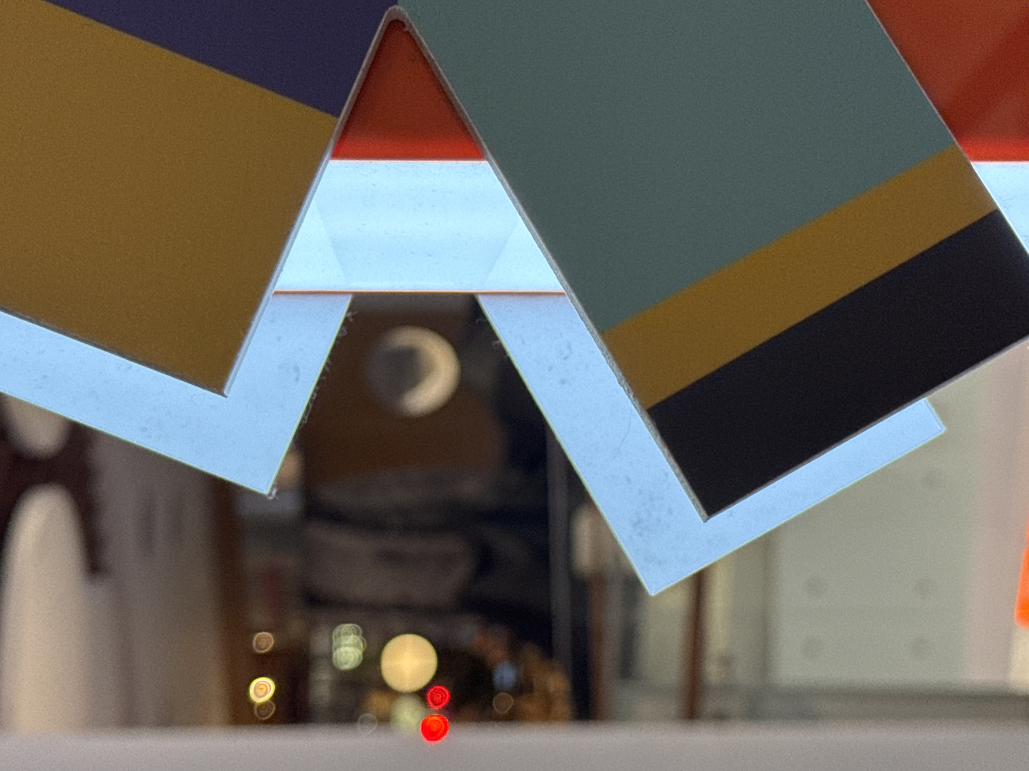 Geometric displays and food hall signage observed in commercial building