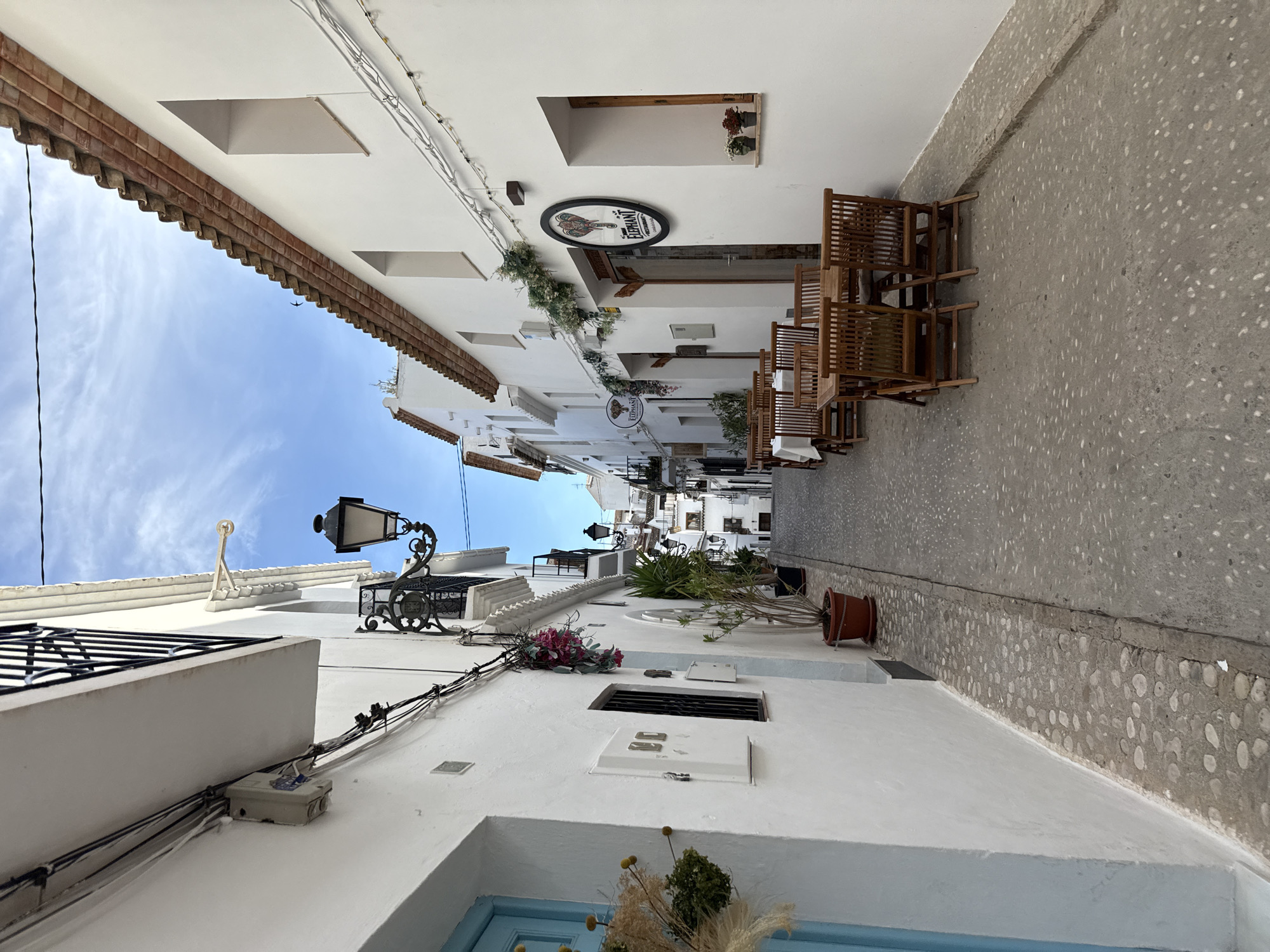 Afternoon street life documented in historic Altea, Spain