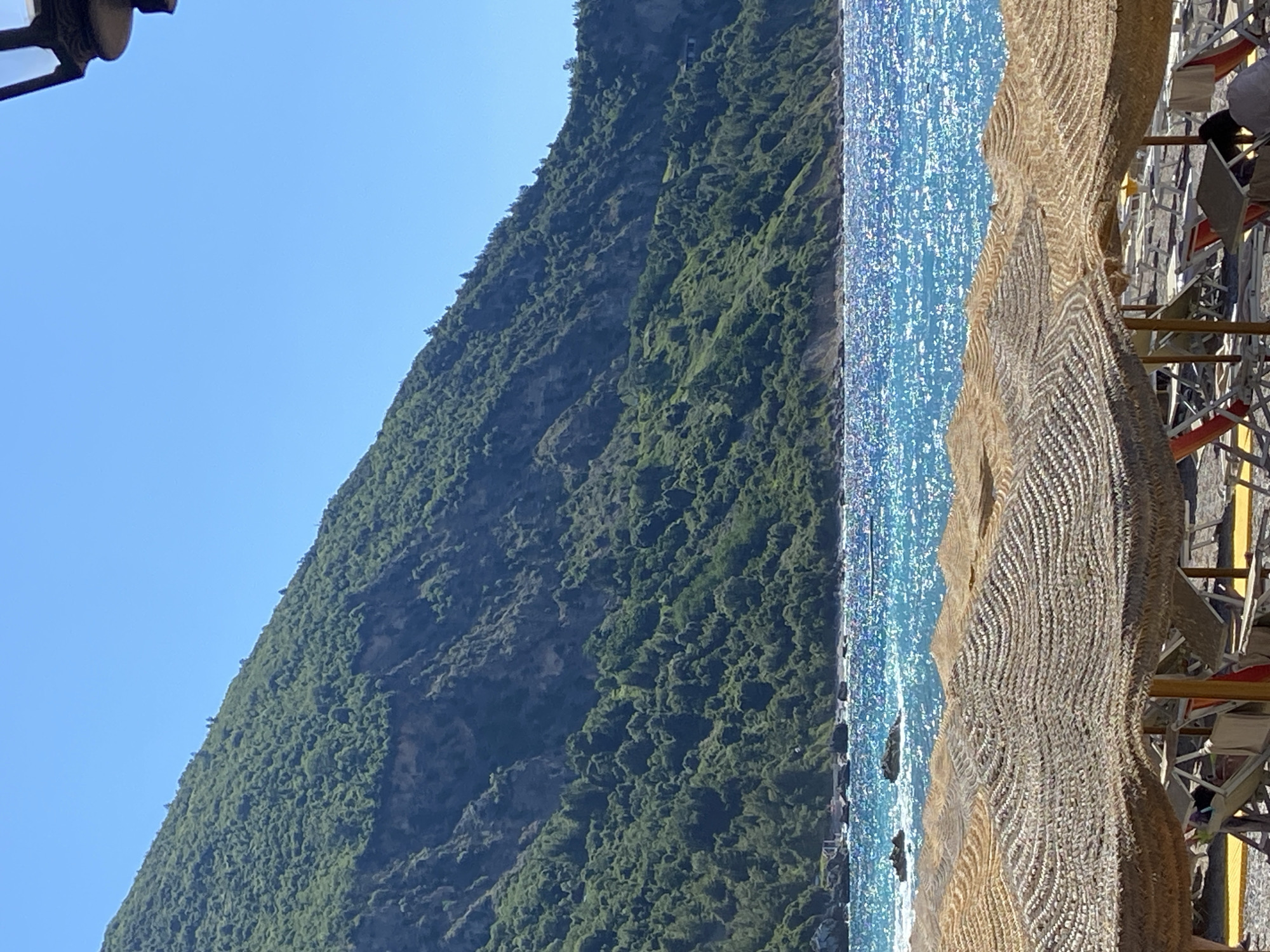 Beach day in Prijevor with thatched umbrellas and mountain views