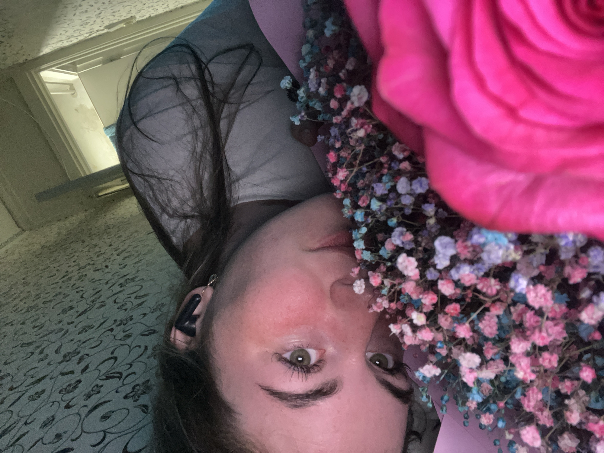 Woman documents quiet evening with flowers and cat in Chaikovsky