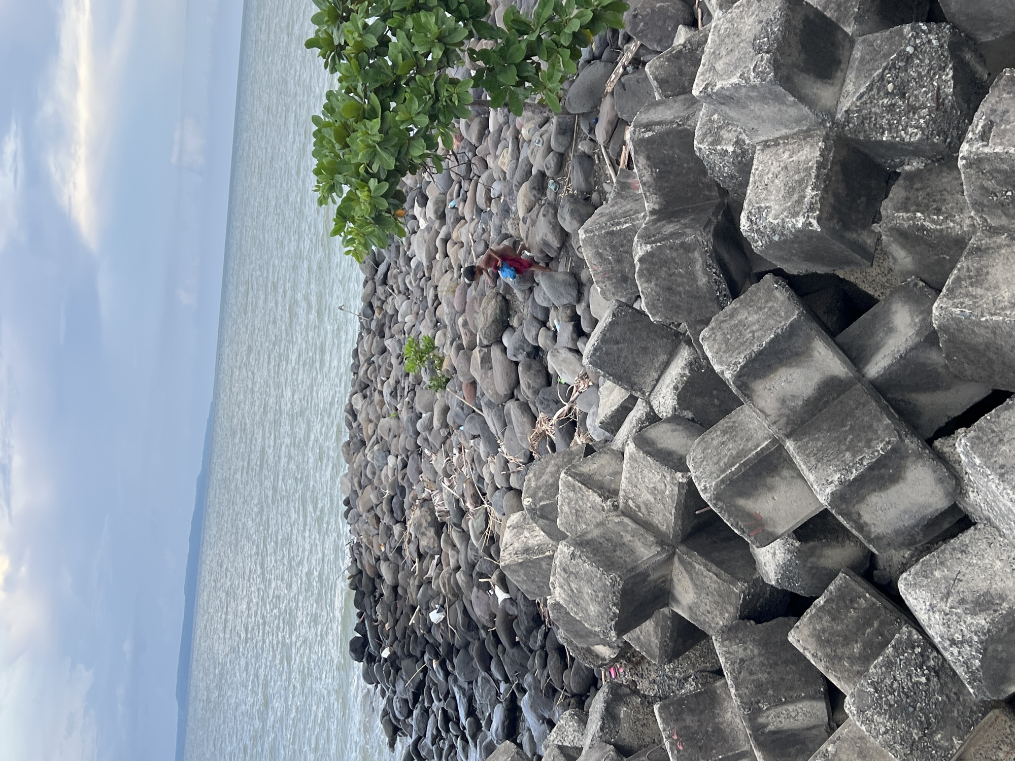 Children play along Davao City seawall during morning hours