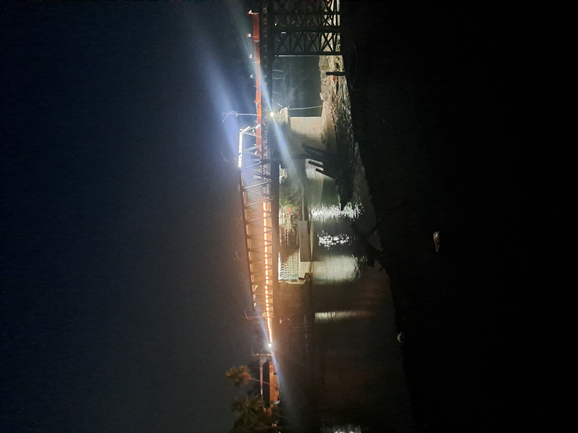 Illuminated bridge observed at night in Tingkeummanyang, Indonesia