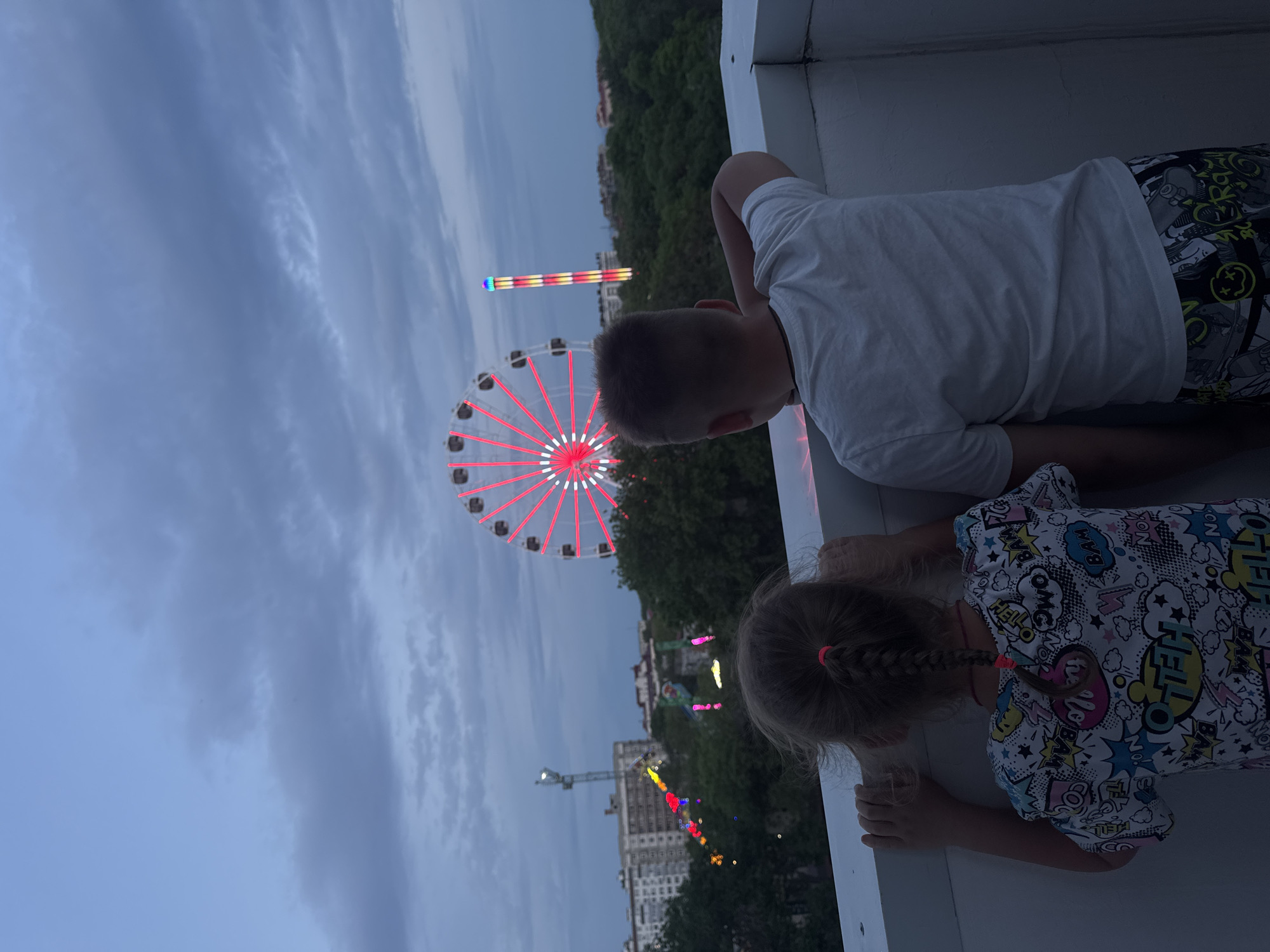 Family enjoys evening at illuminated amusement park in Yevpatoriya