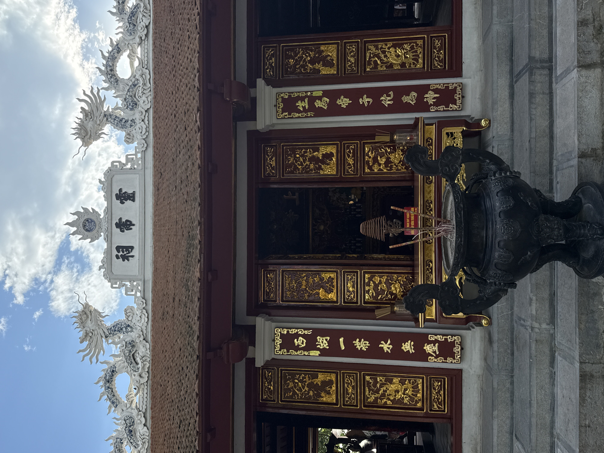Tourist documents traditional architecture during morning walk in Hà Nội