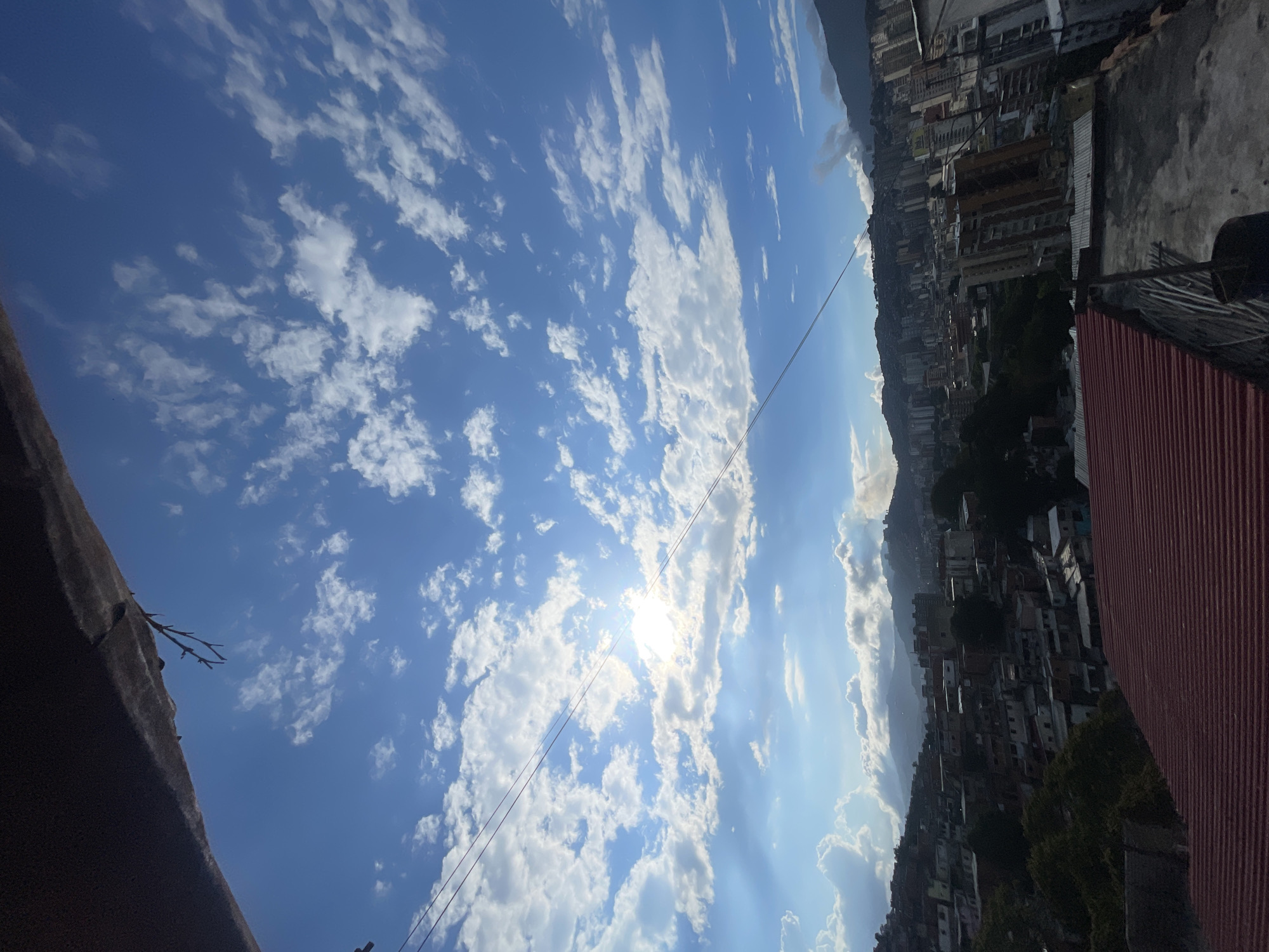 Rooftop view captures sunlit sky in Caracas