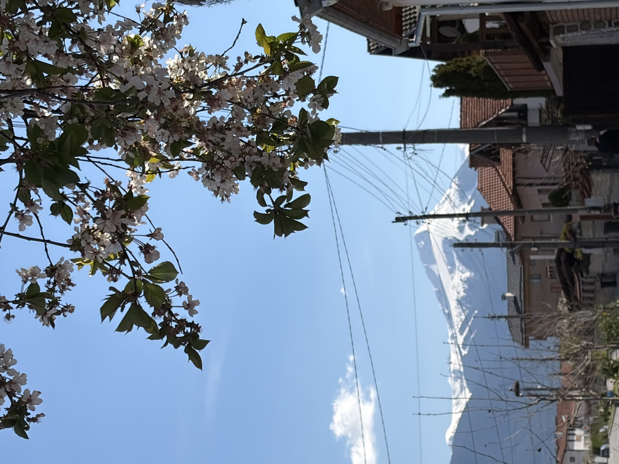 Ordinary moments captured: mountain vista, child playing, daytime moon