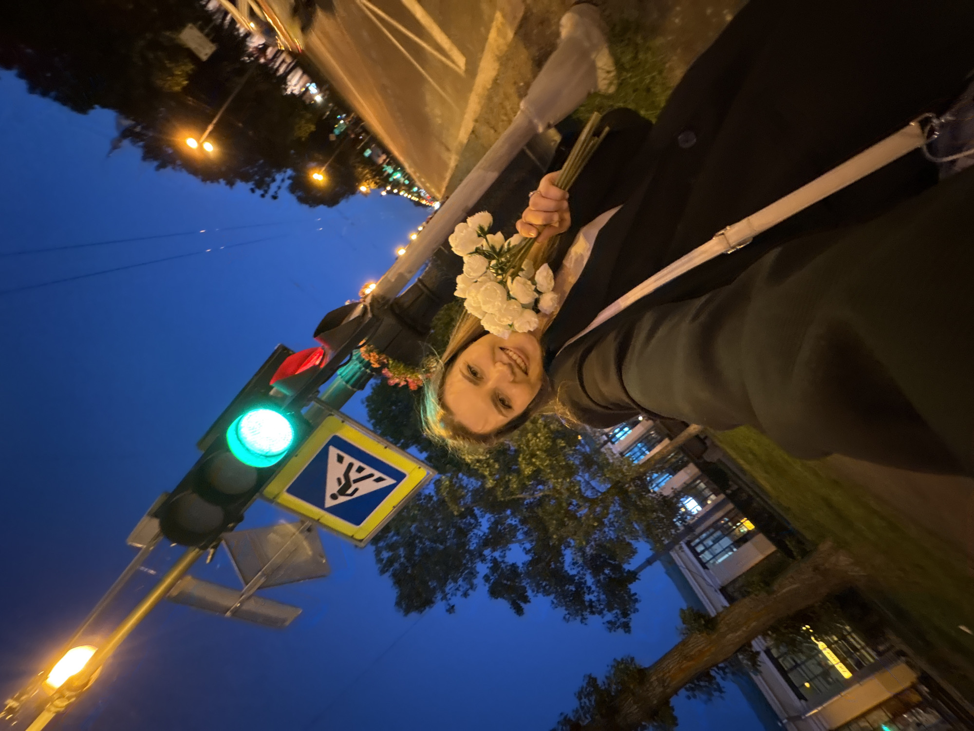Evening stroll through Saint Petersburg landmarks with white flowers in hand
