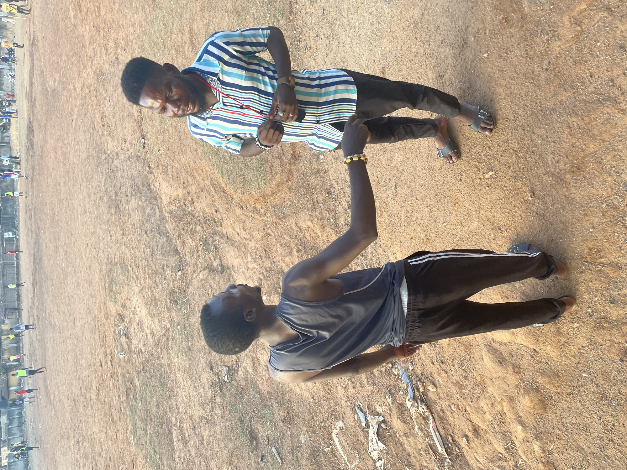 Sports training session documented on dirt field in Akwanga