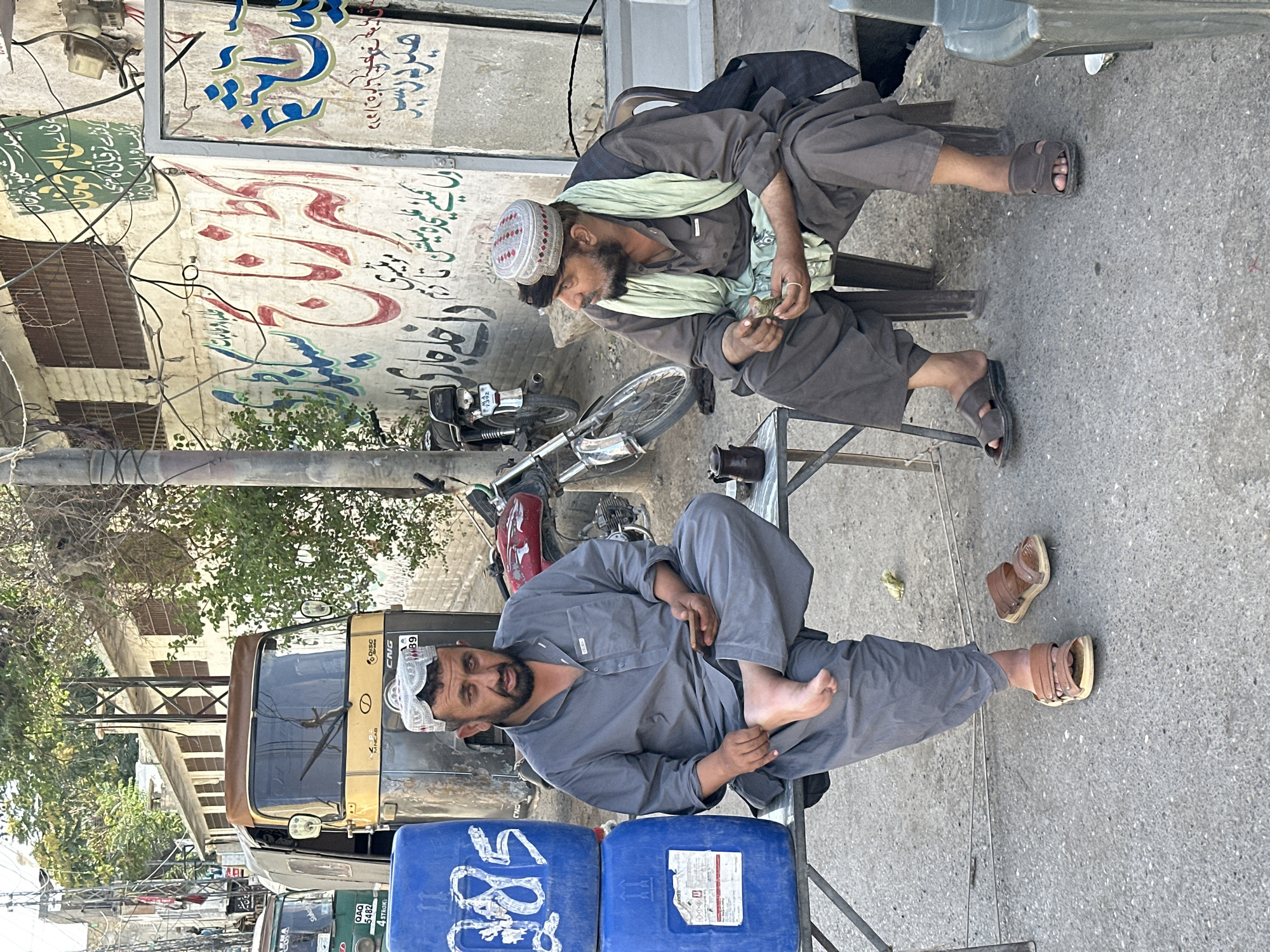 Everyday street life across a busy Quetta neighborhood