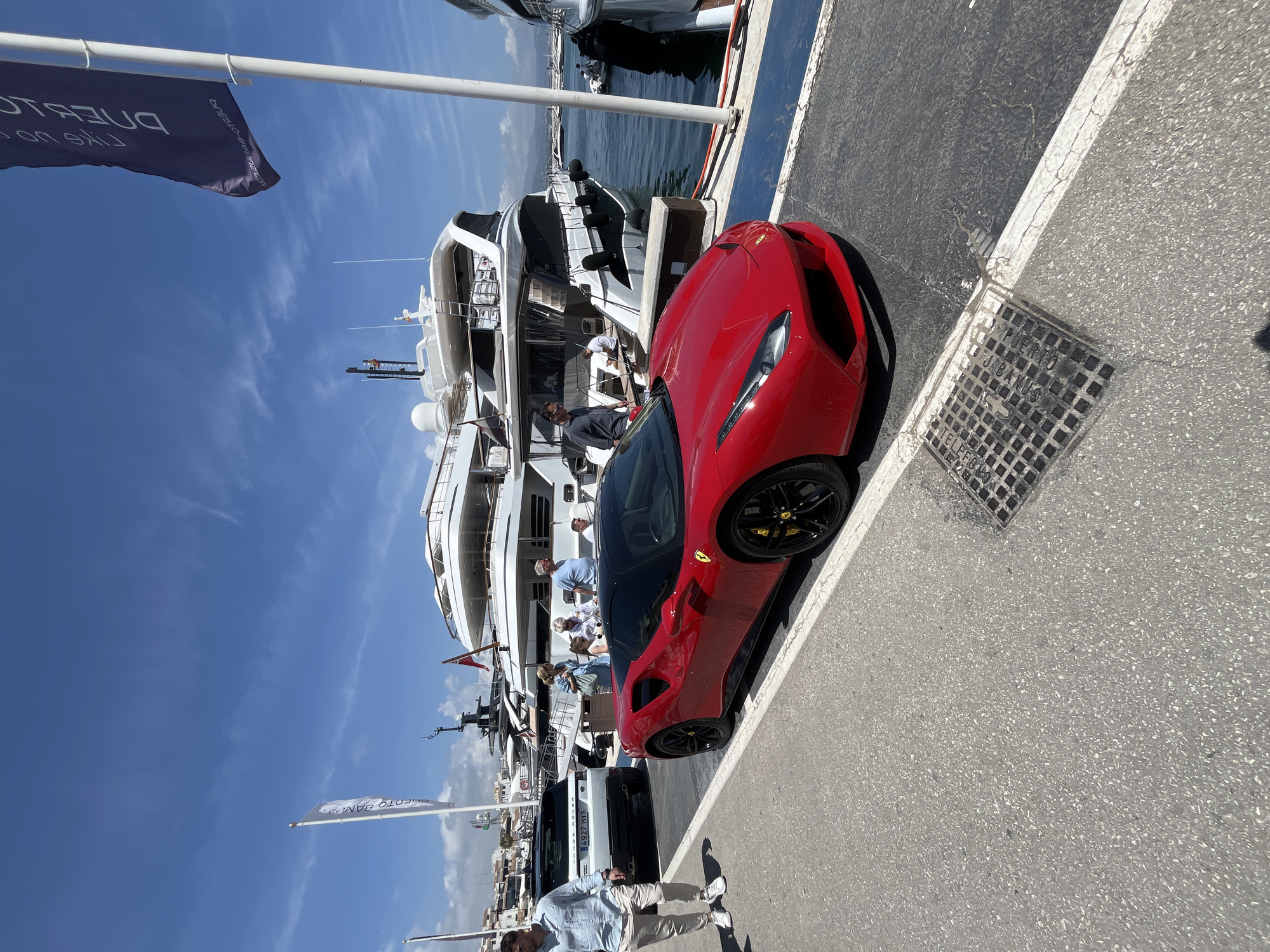 Luxury cars gather at Puerto Banús marina in Marbella