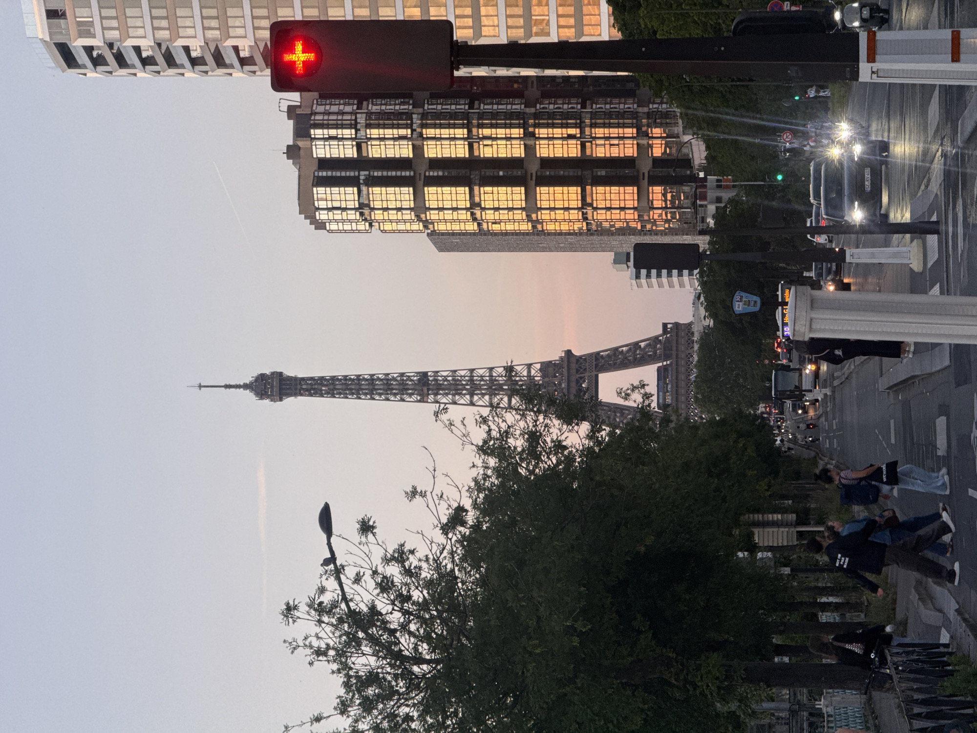 Eiffel Tower photographed against pink sunset sky in Paris