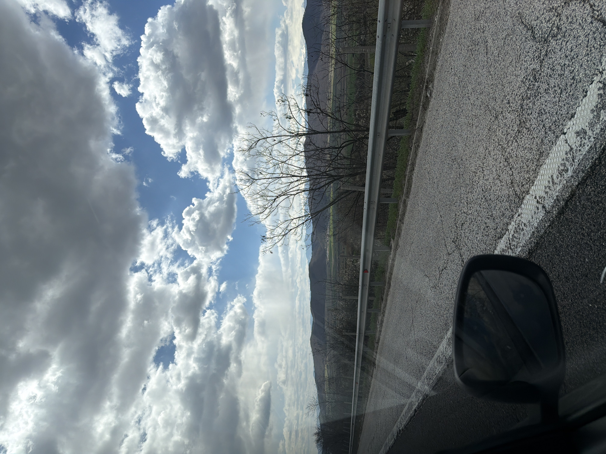 Vehicle travels highway near Ihtiman, Bulgaria capturing roadside scenery