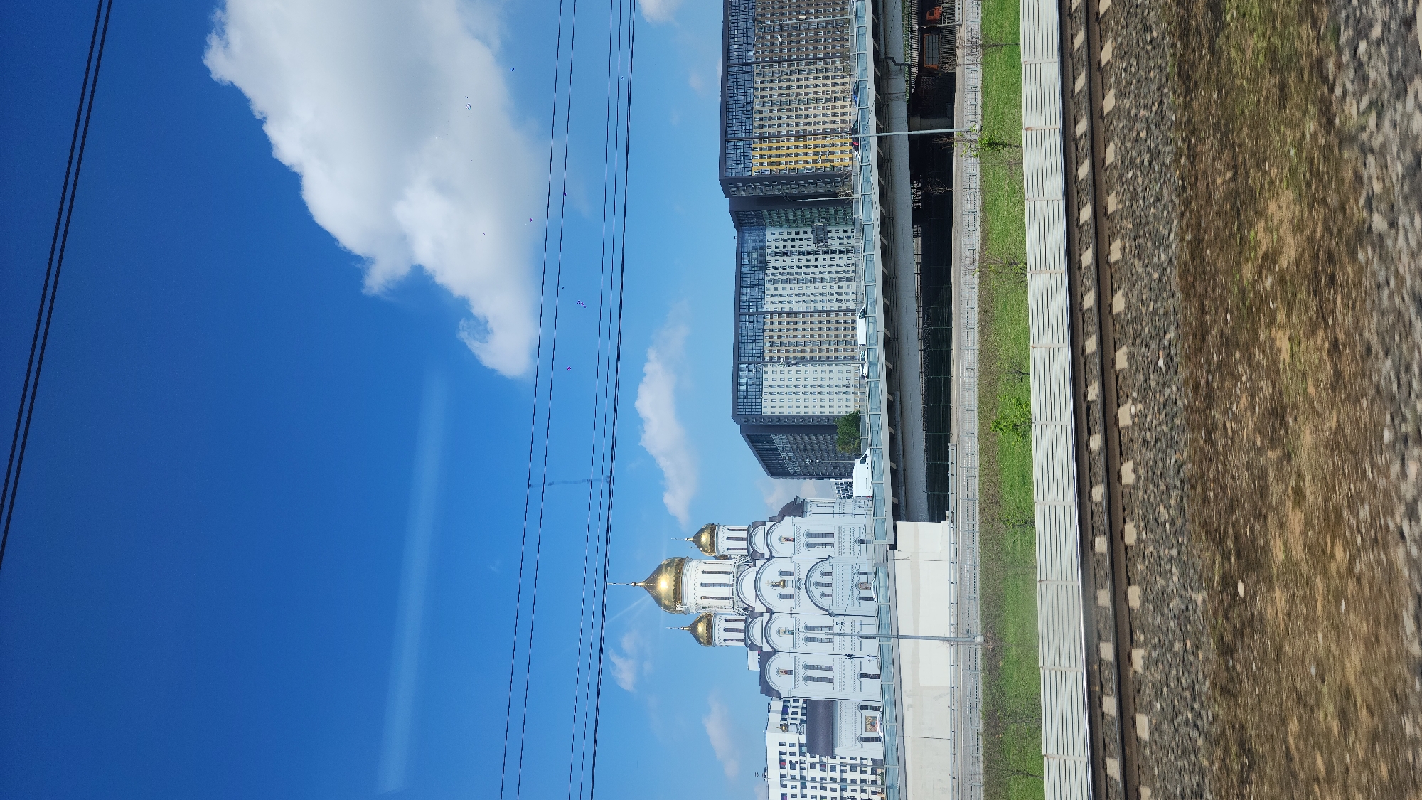 Orthodox church and covered walkway documented in urban setting