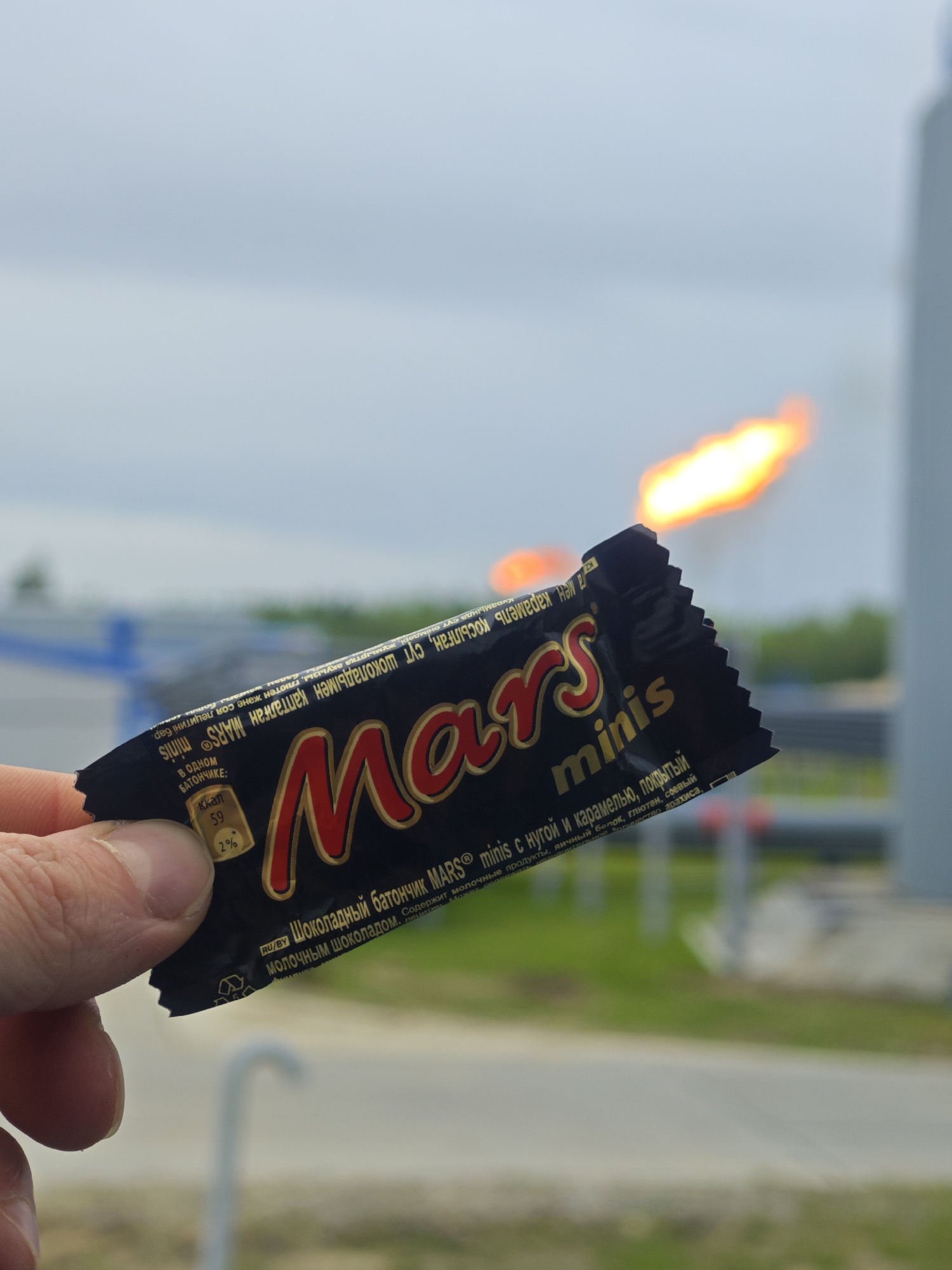Person documents Mars chocolate bars, Audi, workspace moments
