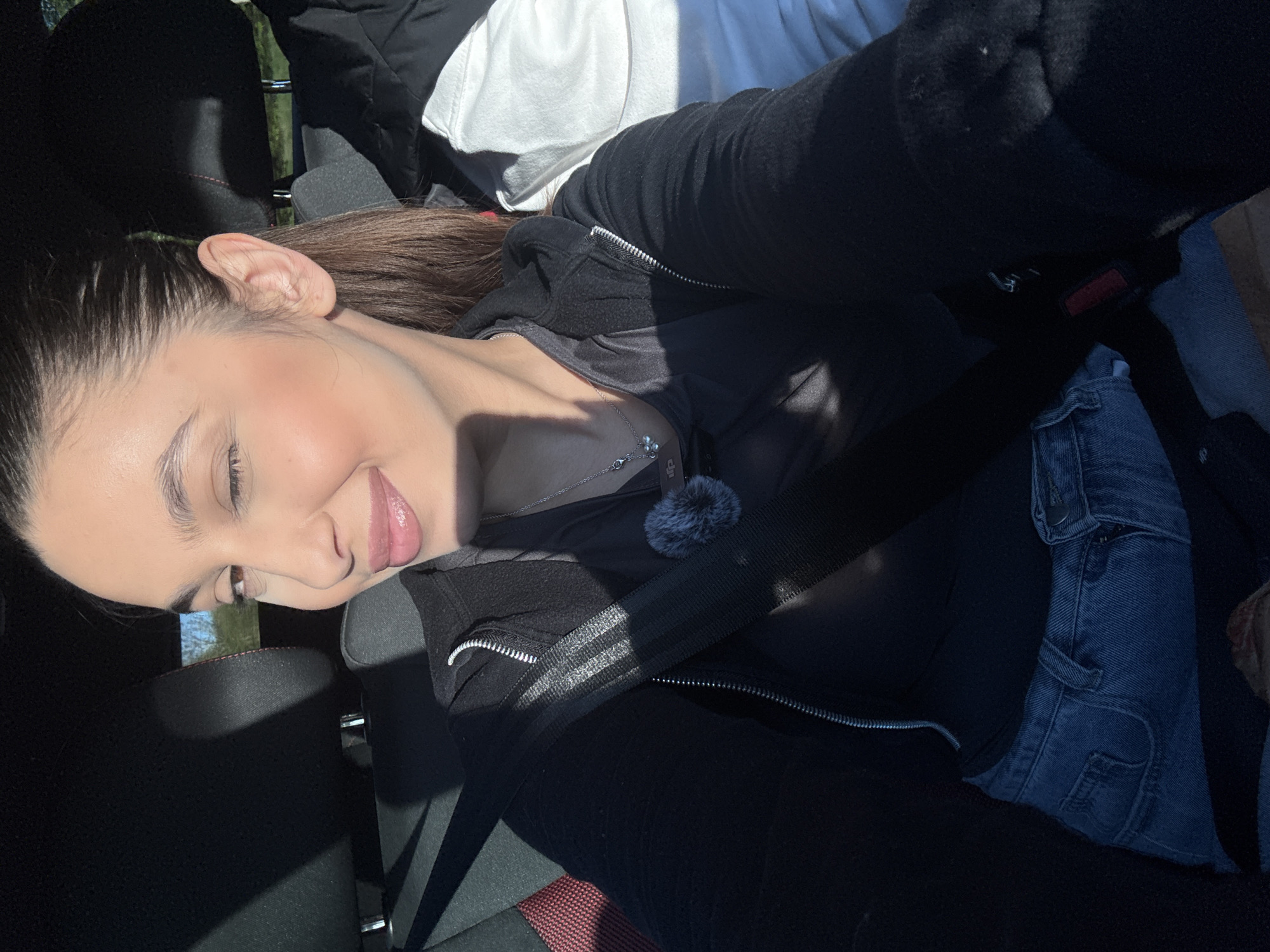 Woman takes selfie while seated in car in Mönchengladbach