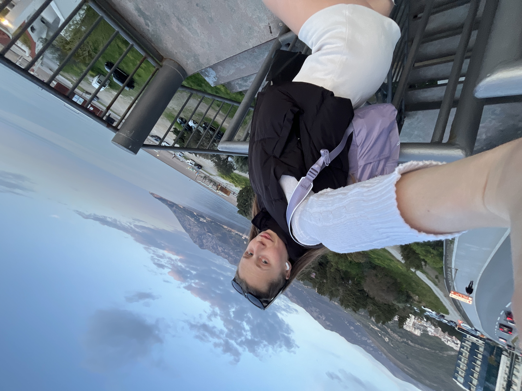 Tourist takes selfie while walking through Montenegrin coastal town