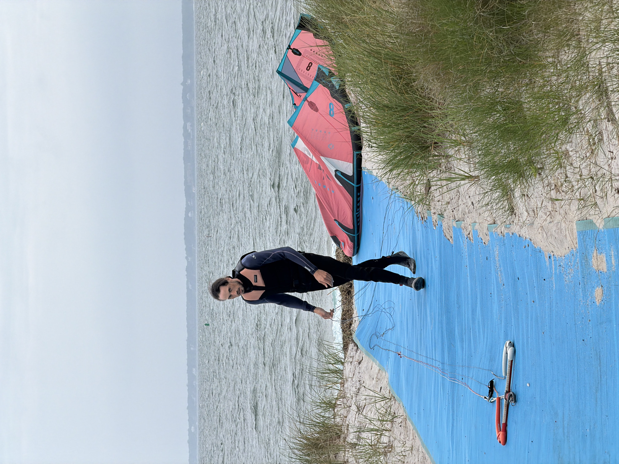Kitesurfing session on a cloudy Southampton beach afternoon