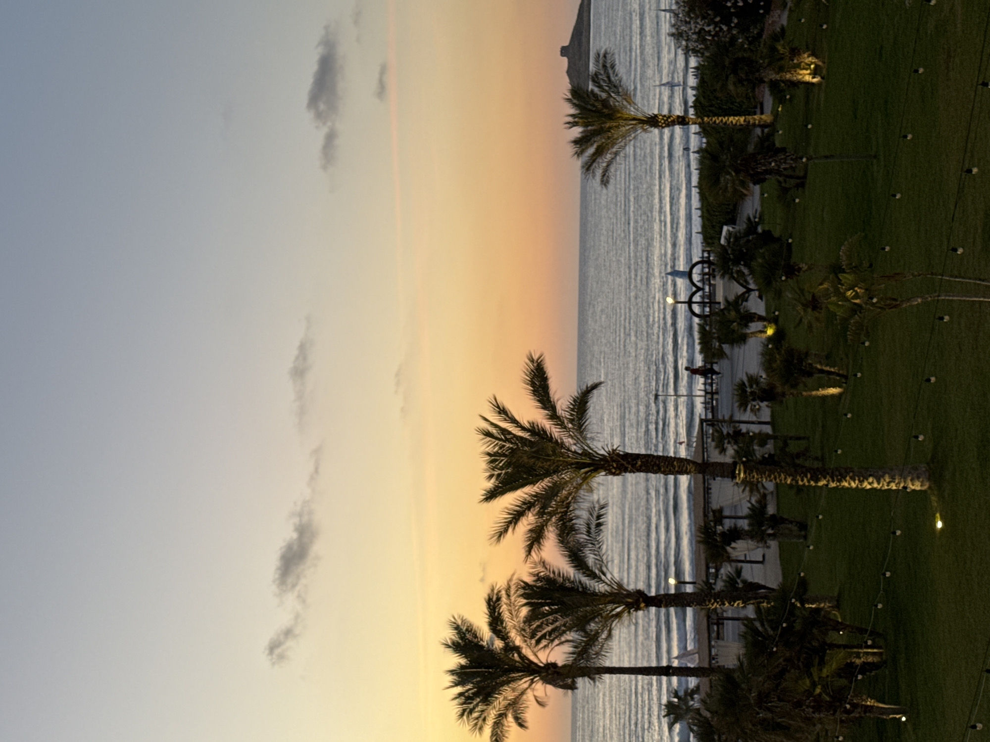 Family evening at Italian seaside resort captured in twilight