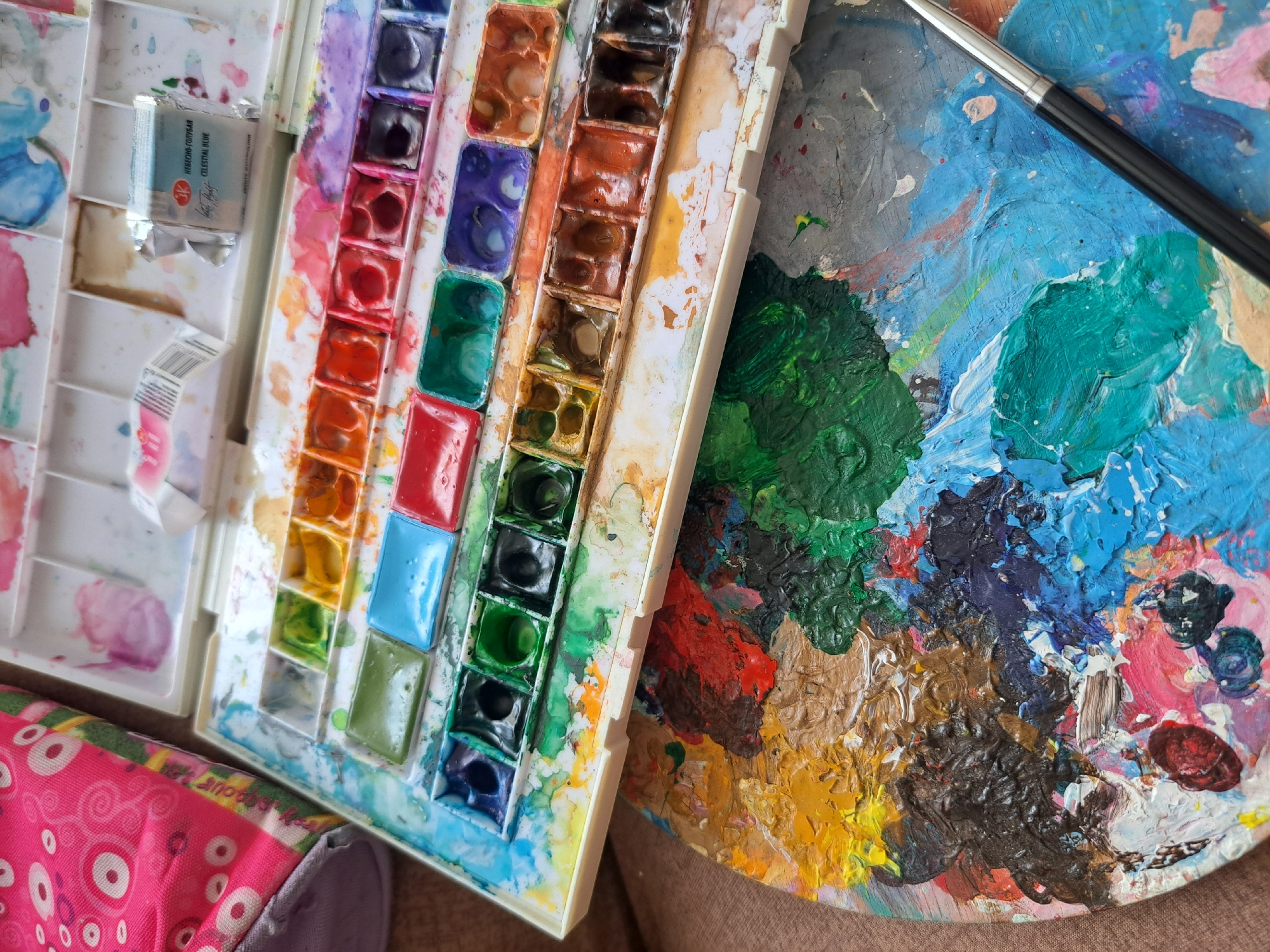 Artist's palette and supplies at a window in Popovo