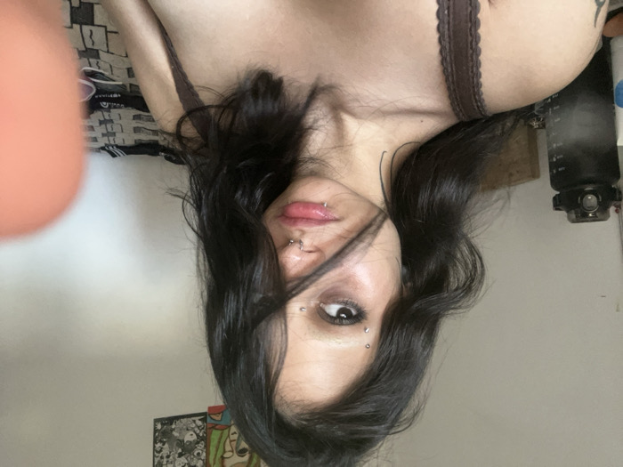 Woman with facial piercings photographed in Buenos Aires apartment