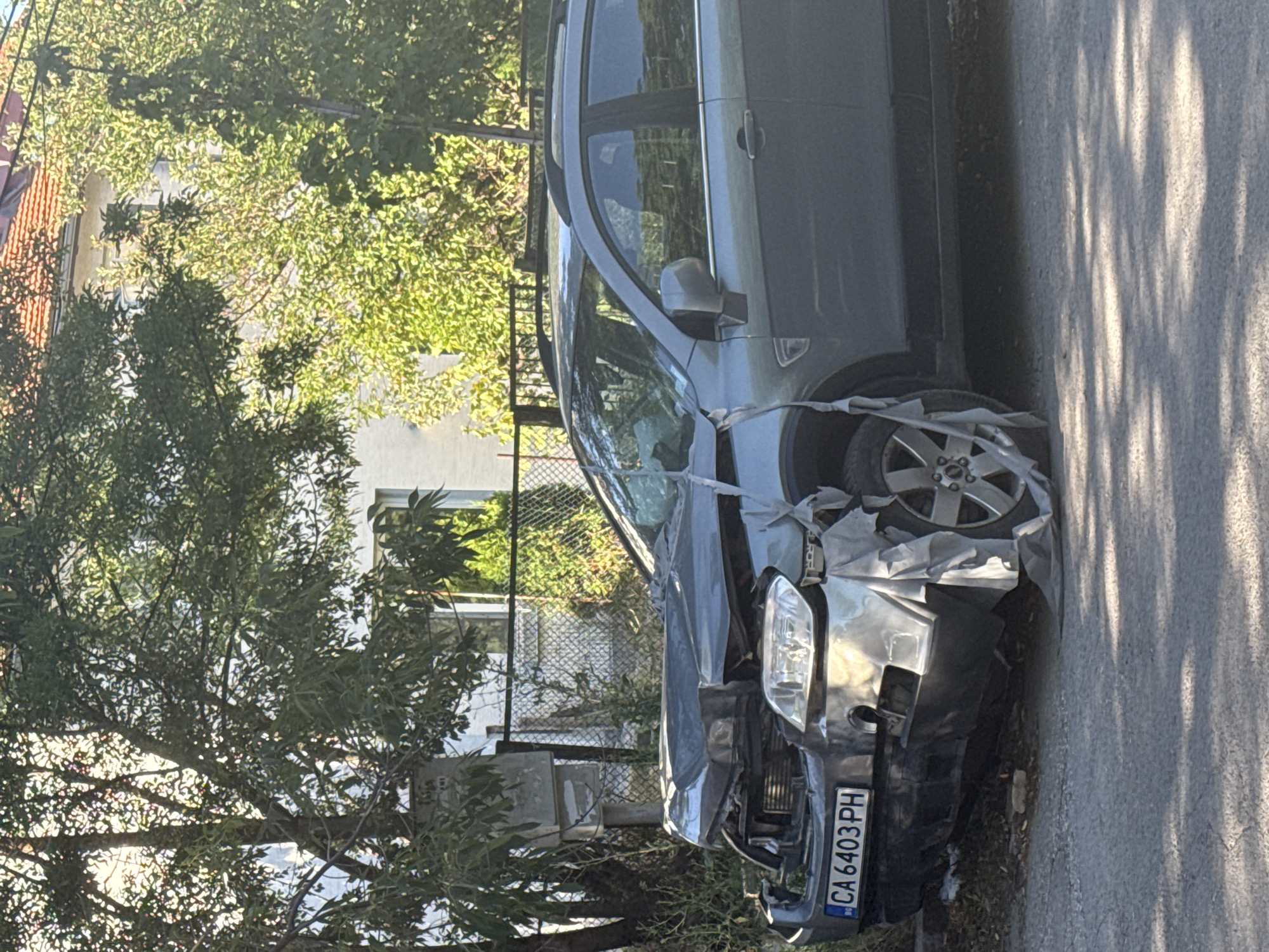 Crash scene and outdoor food festival overlap in Sofia afternoon