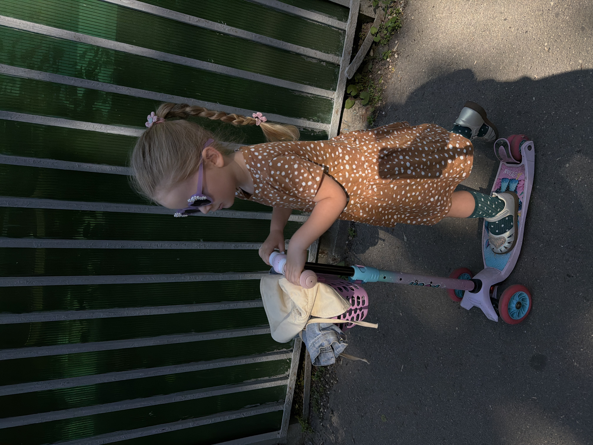 Girl rides scooter in early morning Moscow