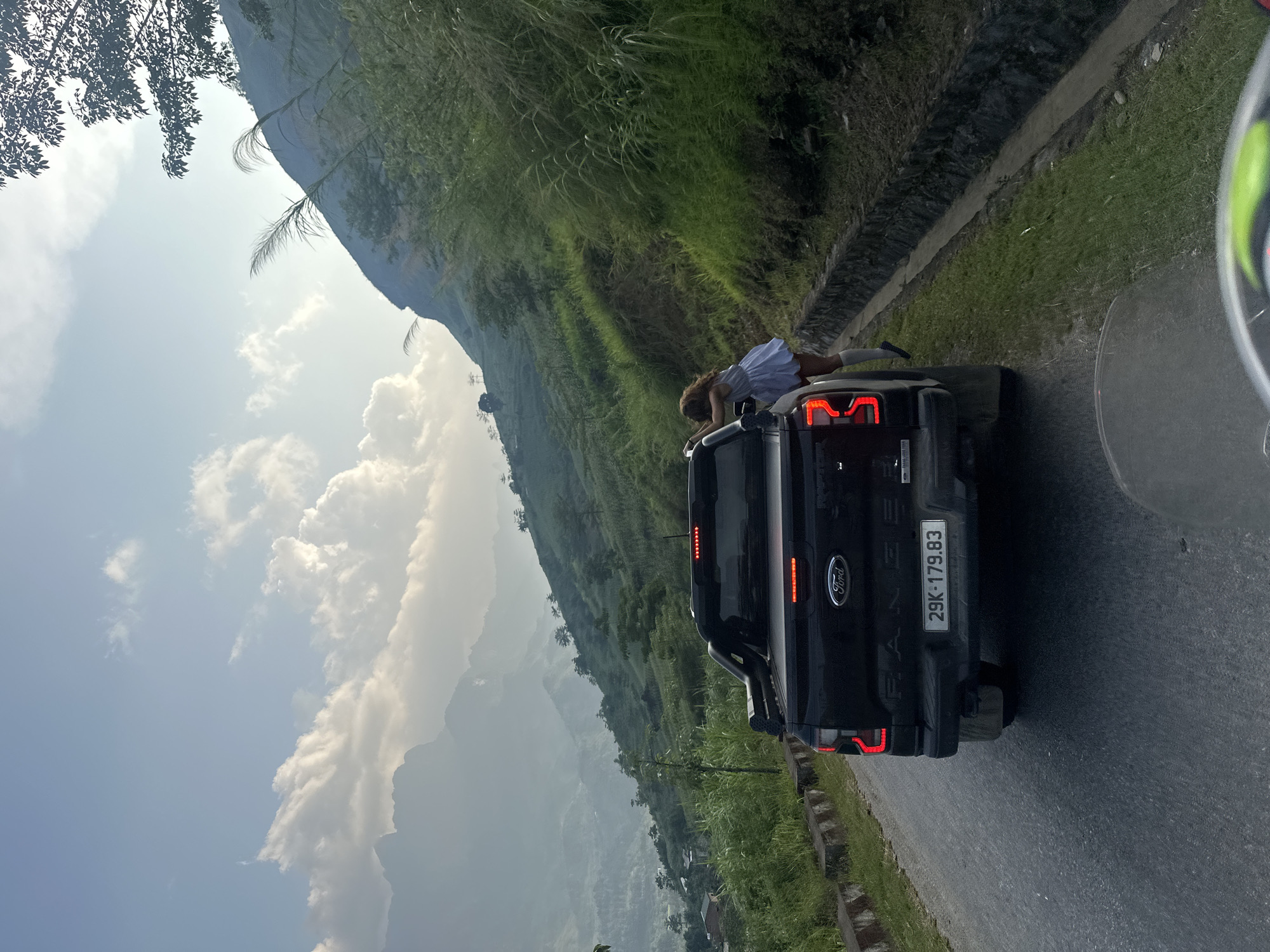 Road trip group documents scenic stop in Vietnamese mountains