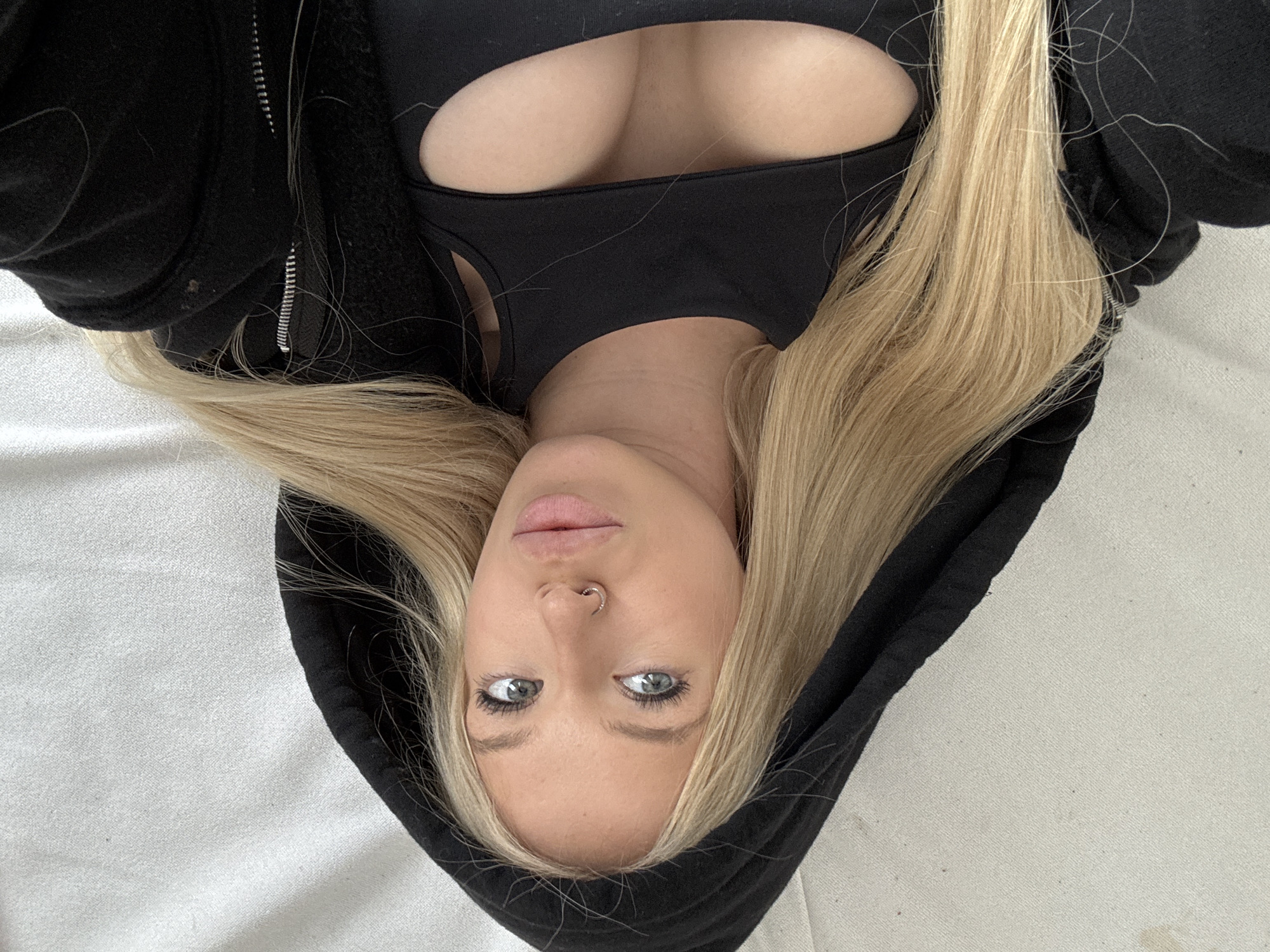 Close-up rotated portrait in Saint Petersburg, black jacket.